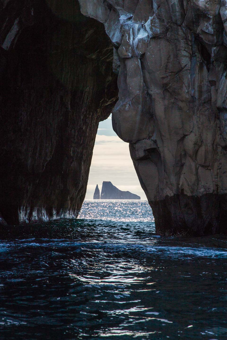 Kicker Rock (León Dormido) framed by the sea arch at Cerro Brujo, San Cristóbal, Galápagos Islands, Ecuador