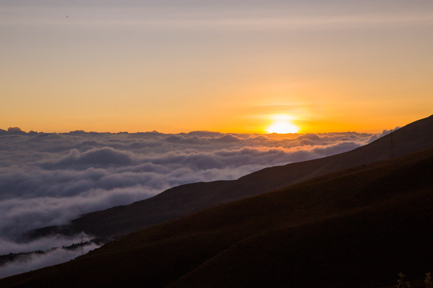 Sunset above the clouds at TeleferiQo, Quito, Ecuador