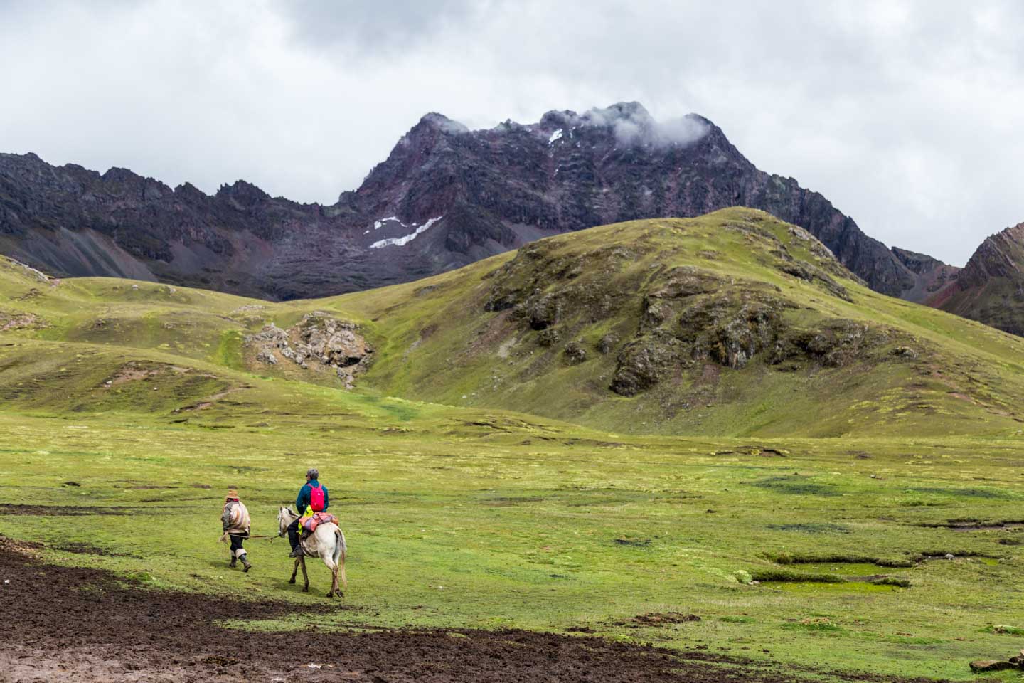 Local renting a horse up to Rainbow Mountain, Peru