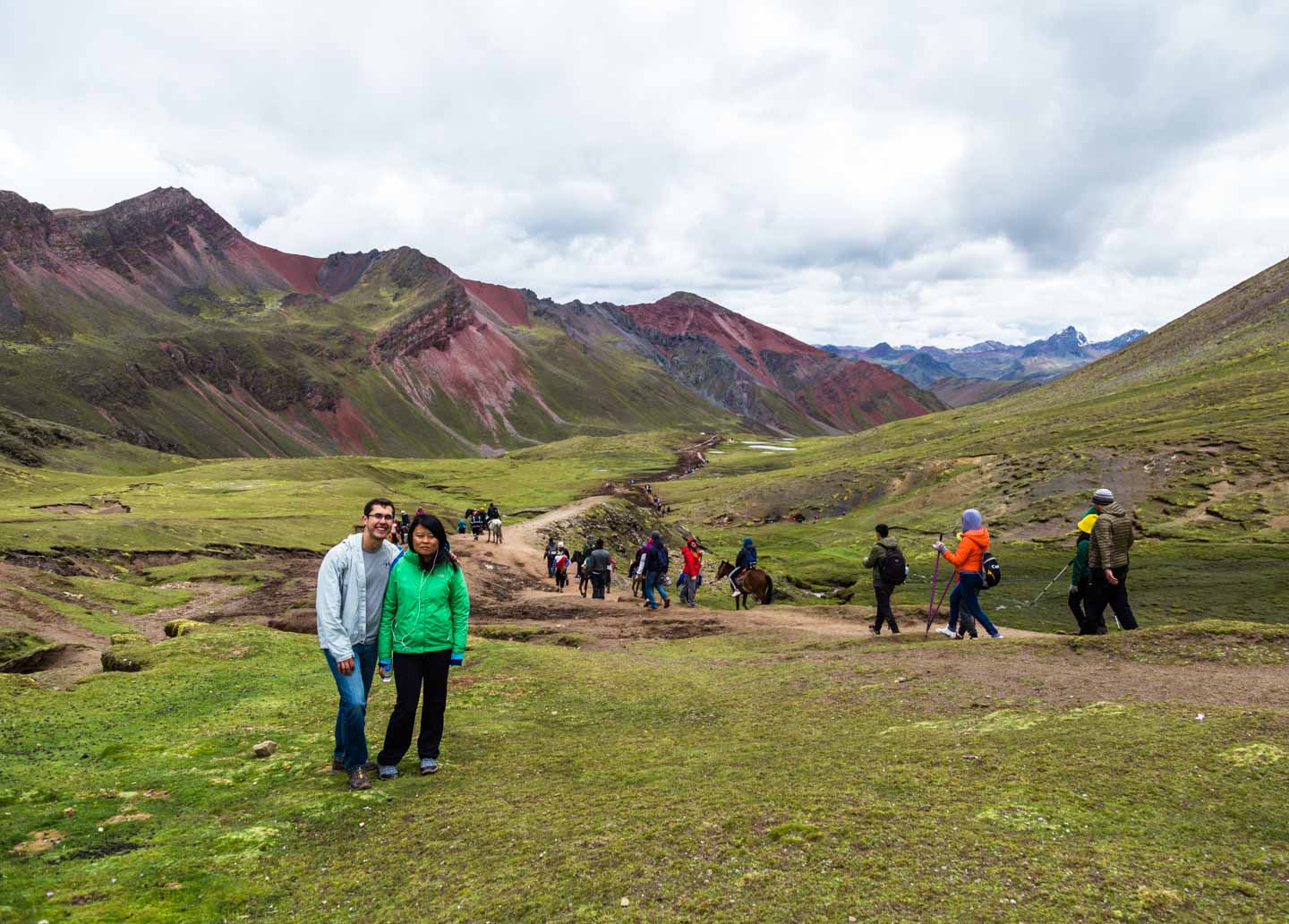 Julie and Carlos hiking down from Rainbow Mountain, Peru
