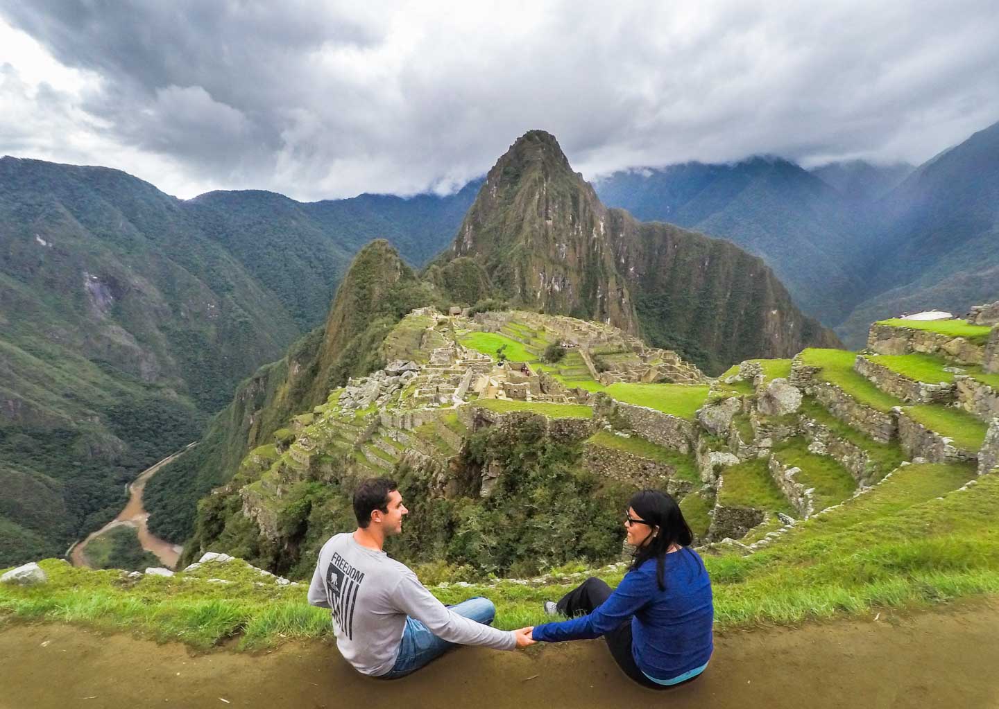 Julie and Carlos peacefully enjoying the view of Machu Picchu, Peru