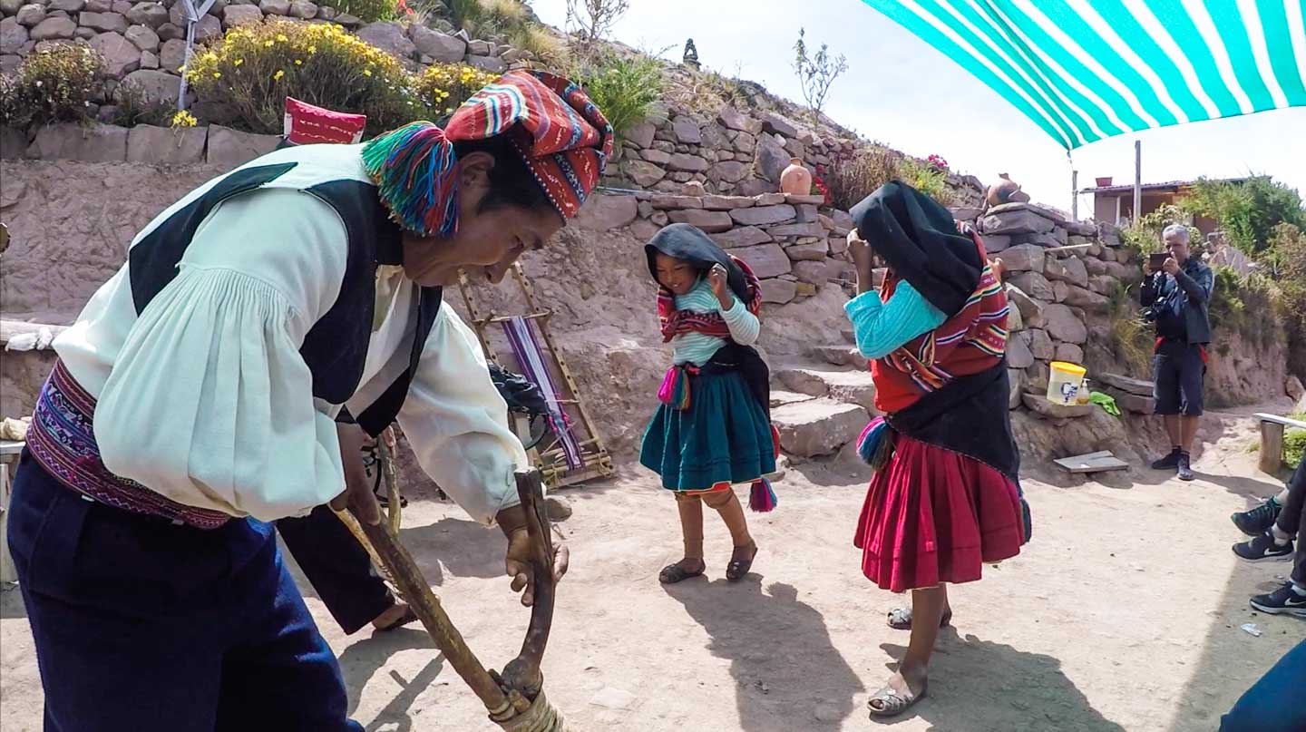 Typical dance in Taquile displaying the cropping process on the island, Taquile Island, Lake Titicaca, Peru