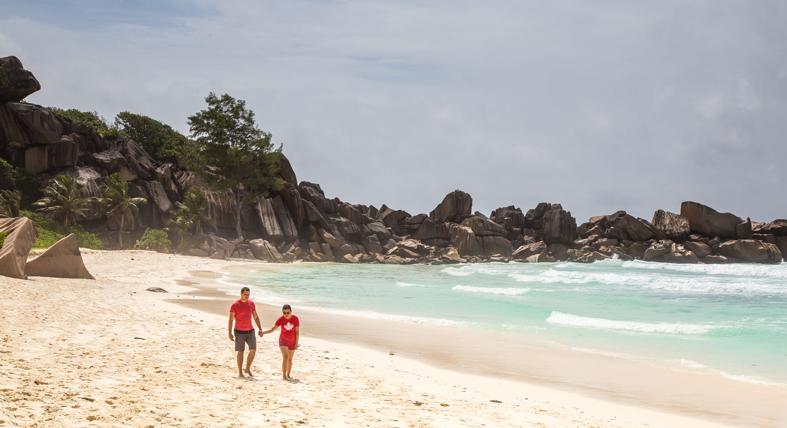 Julie & Carlos walking on Grand Anse, La Digue