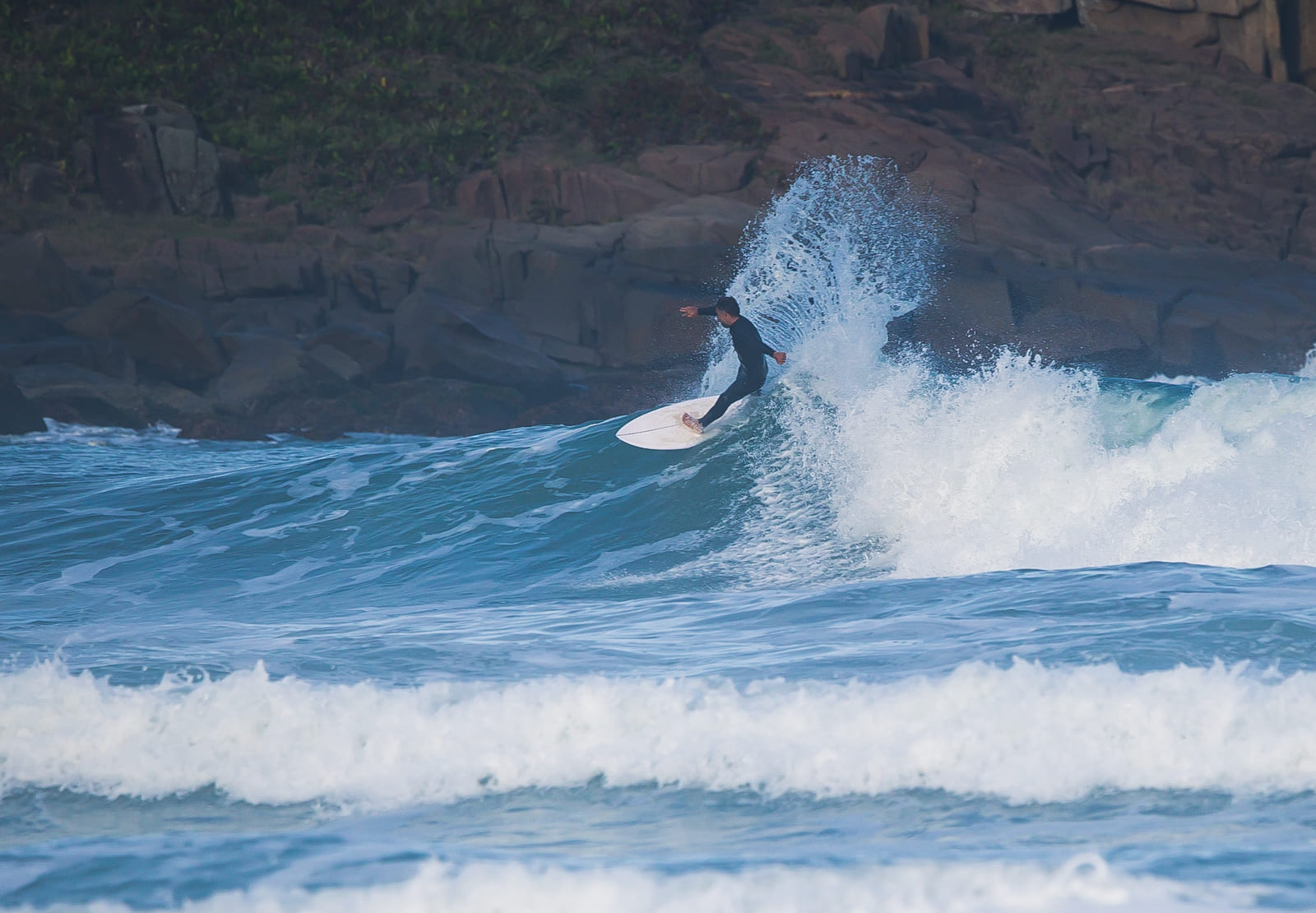 Surfer on Praia do Rosa, Brazil