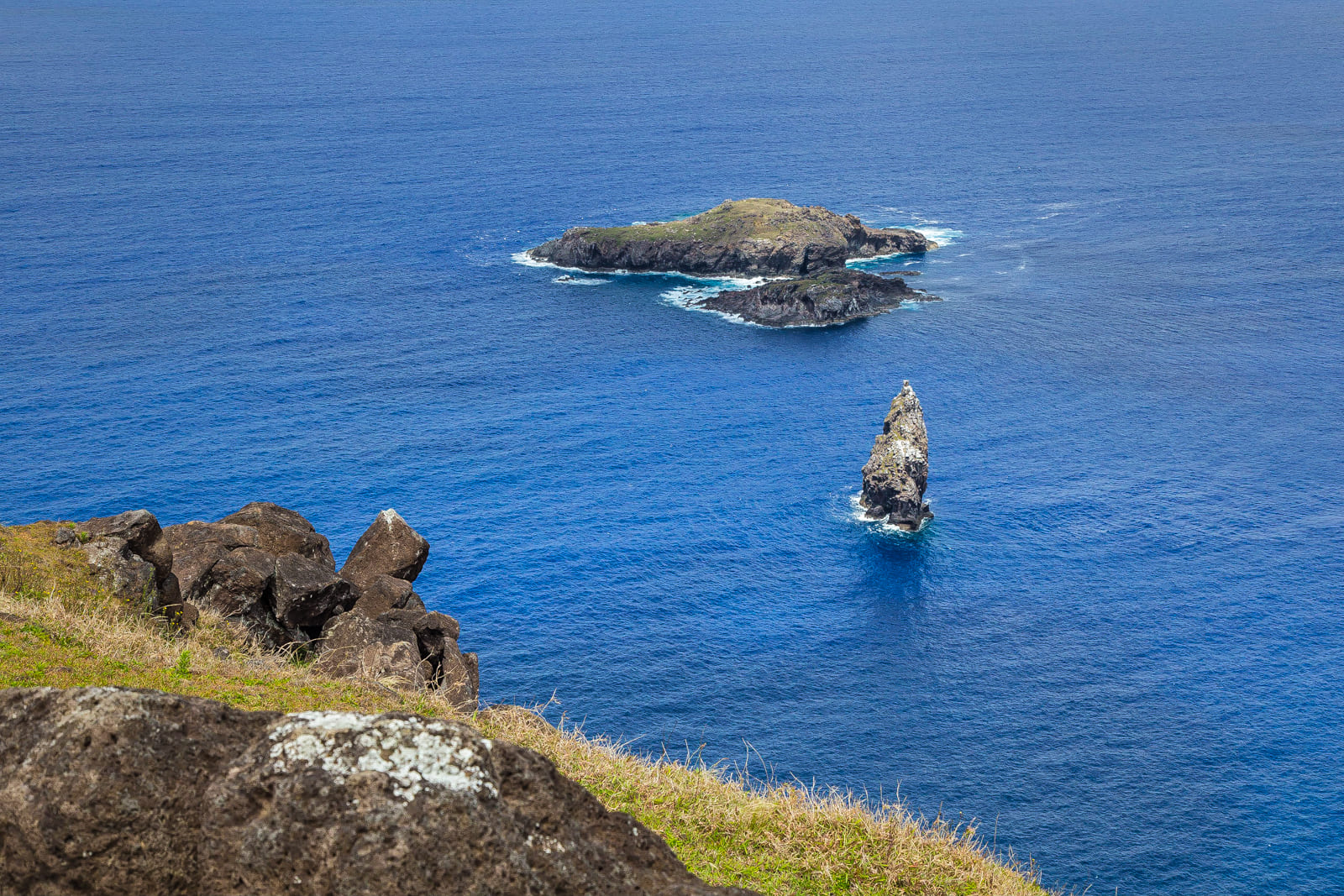 Cliff of Rano Kau overlooking Moto Nui, Easter Island