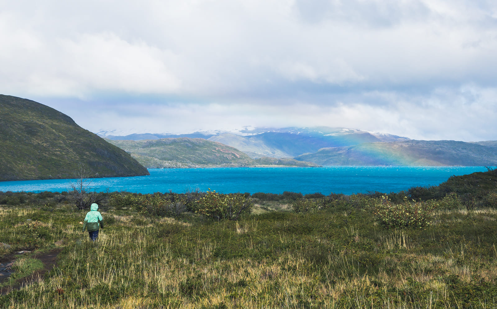 Hiker walking towards Paine Grande campground, Torres del Paine.