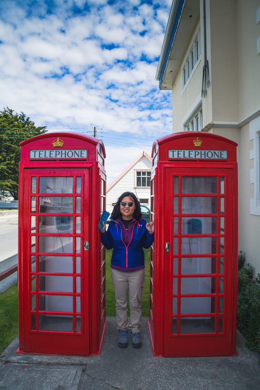 Julie and phone booths in Stanley, Falklands