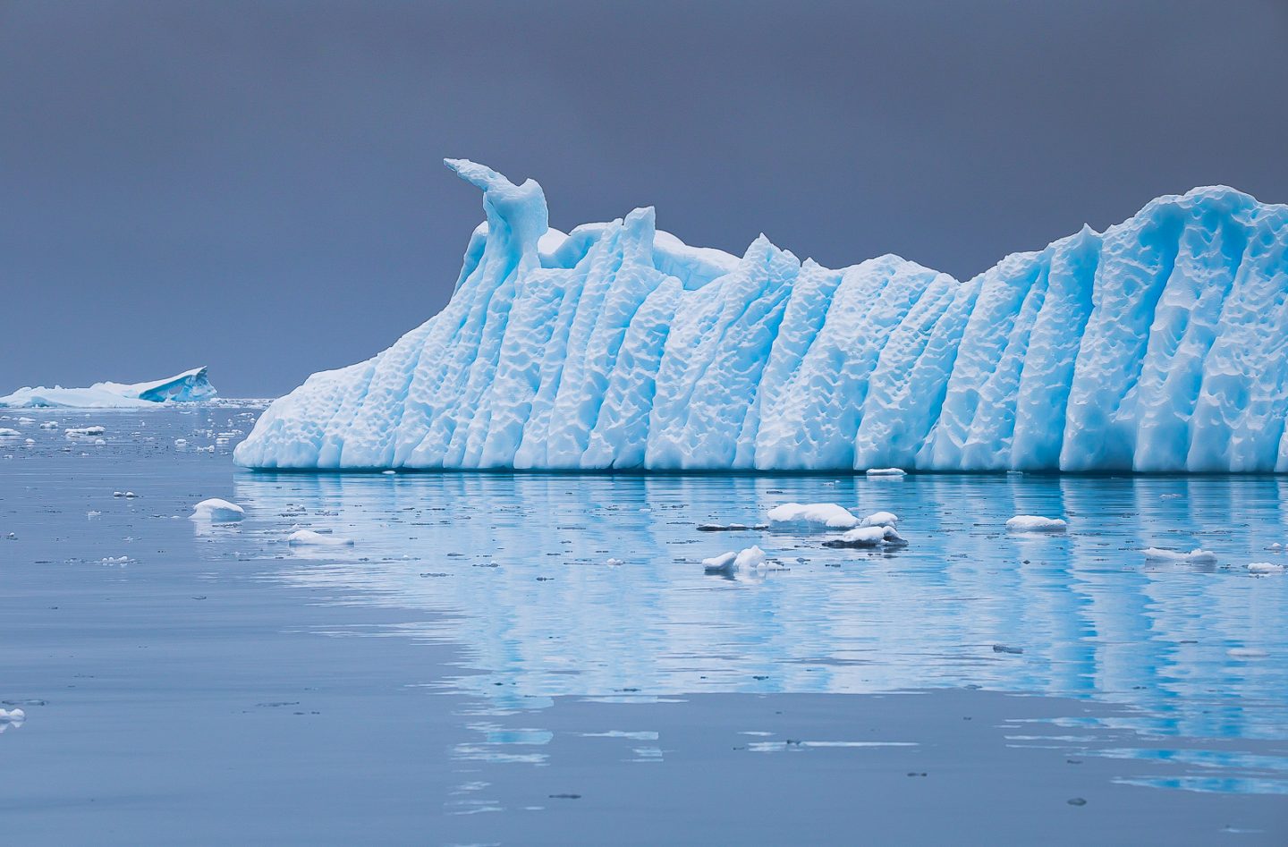 Iceberg sculpted by air and water, Wilhelmina Bay, Antarctica