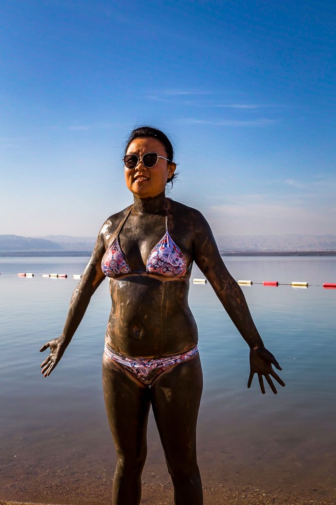 Julie with Dead Sea mud on, Jordan