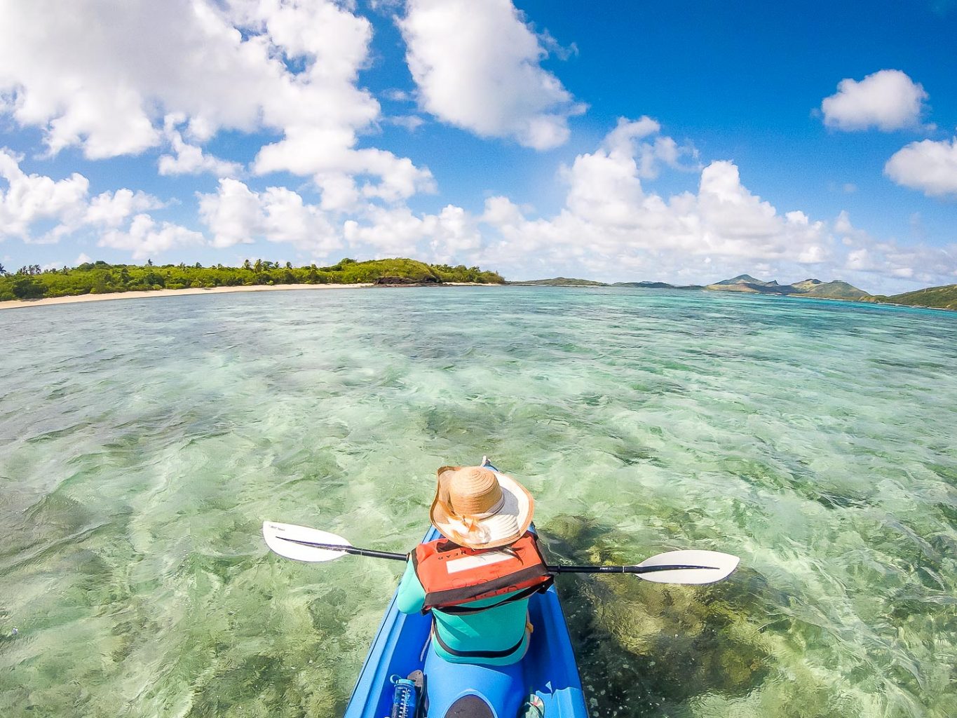 Julie kayaking to the sand bank in the Yasawa Islands, Fiji