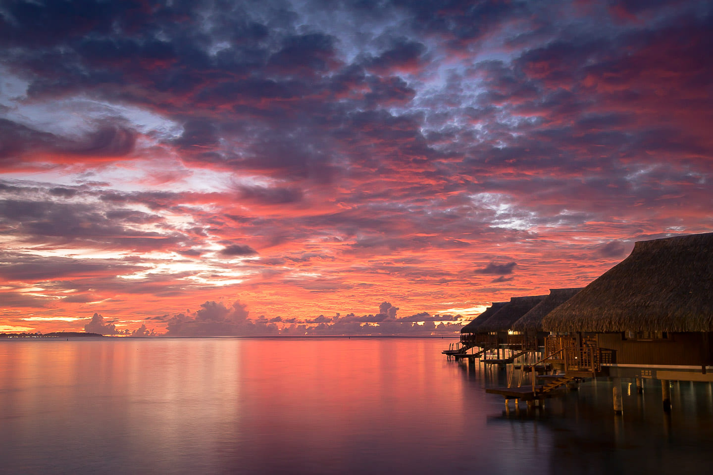 Sunset over the overwater bungalows, Moorea, French Polynesia