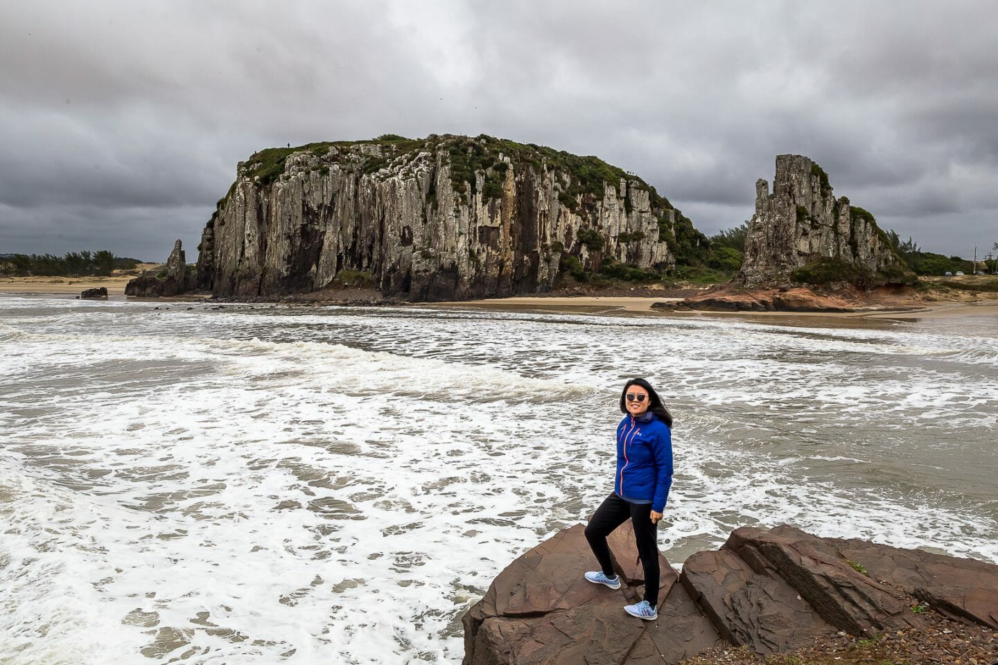 Julie at the edge of the cliffs in Torres, Brazil