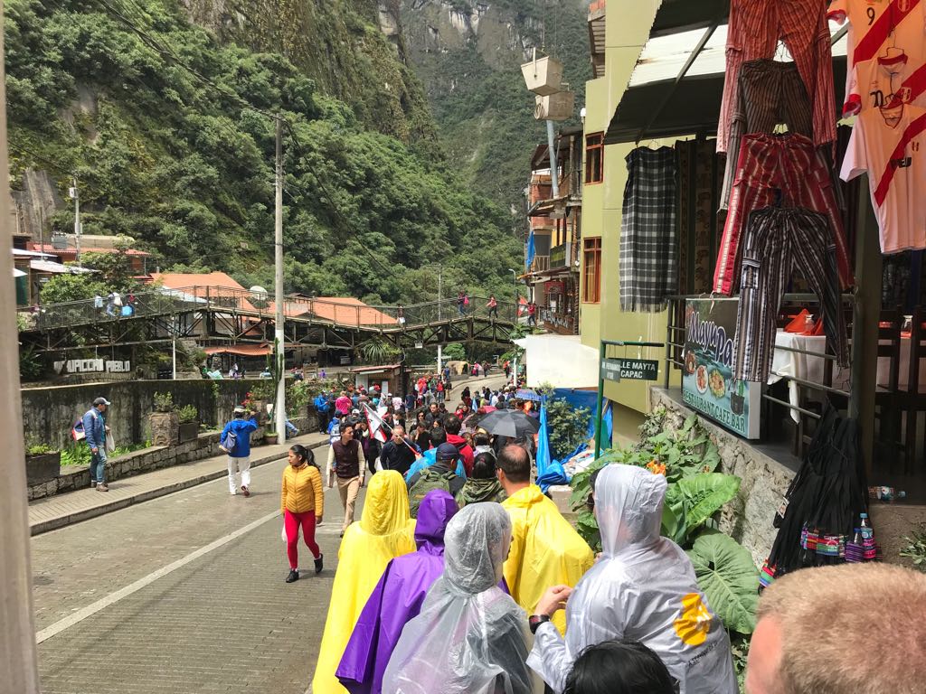 Line of tourists waiting to catch the bus to Machu Picchu, Peru
