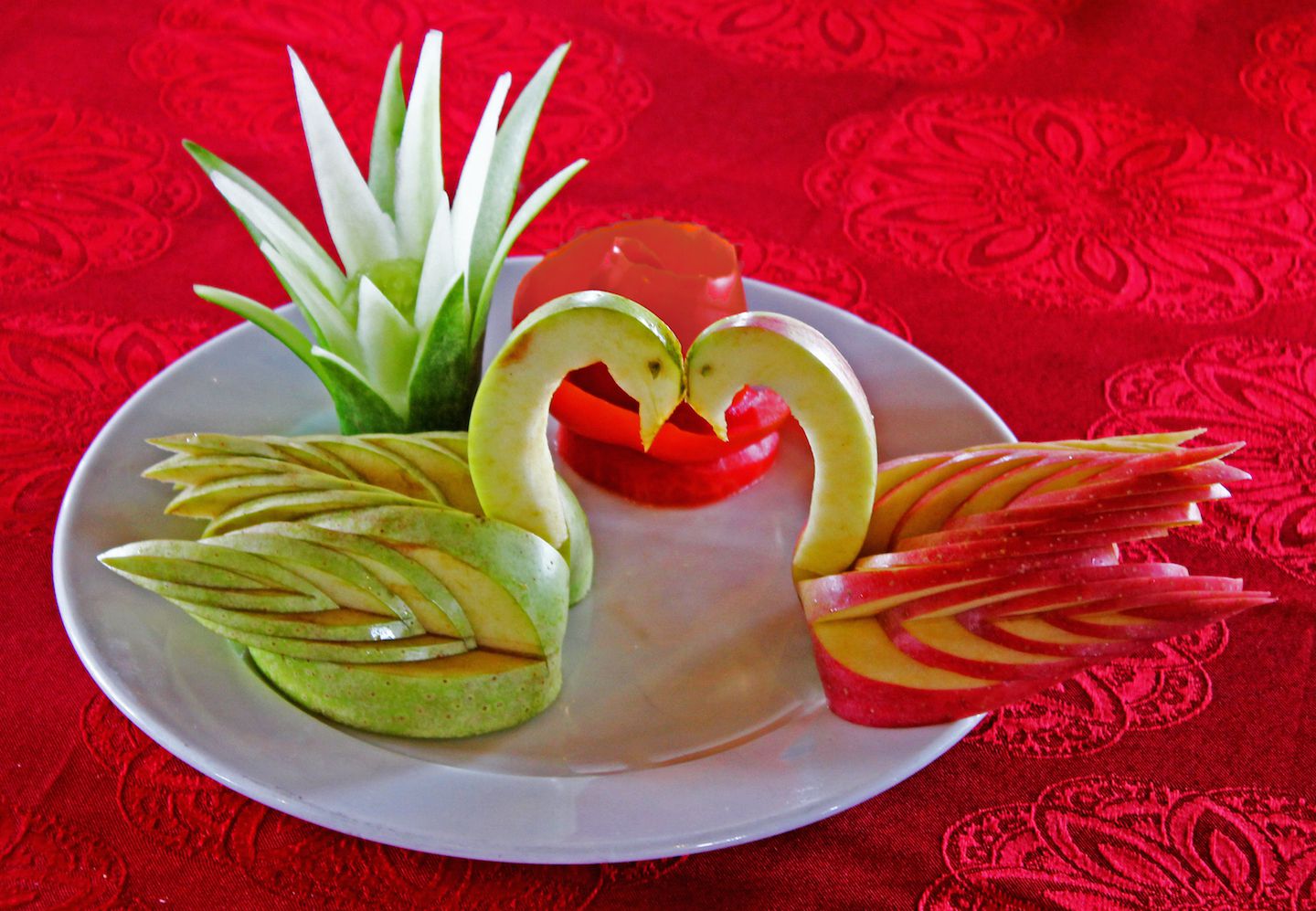 Beautiful apple-carved swans