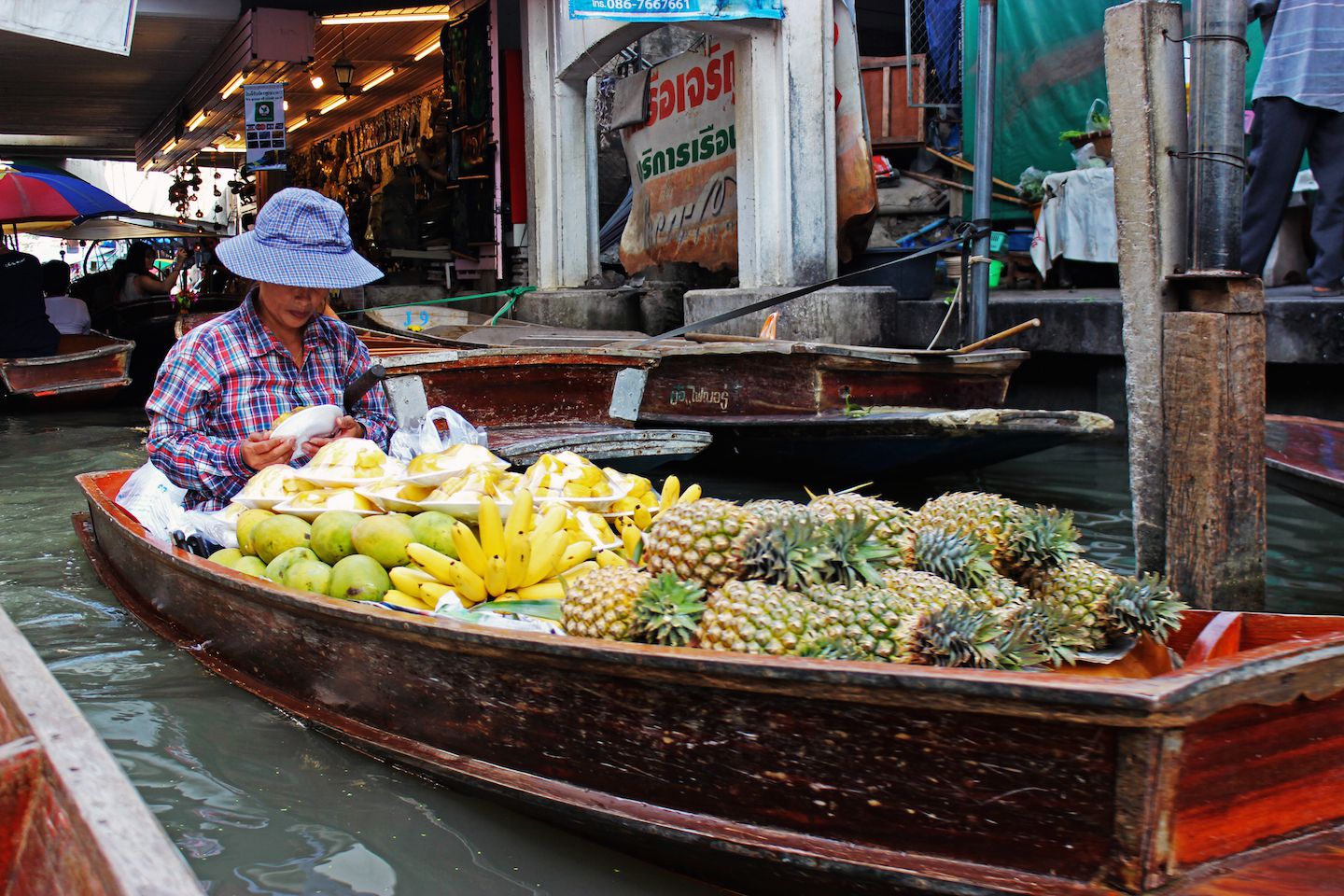 Boat selling fruits at the floating market, Bangkok, Thailand