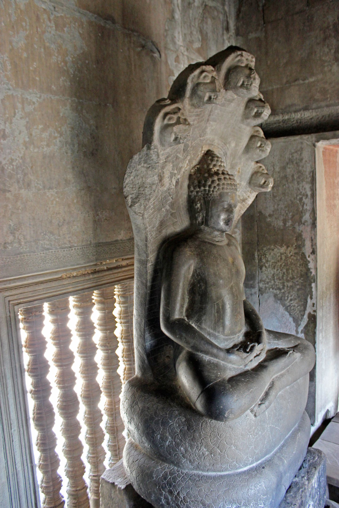 Buddha sitting on a Naga at Angkor Wat