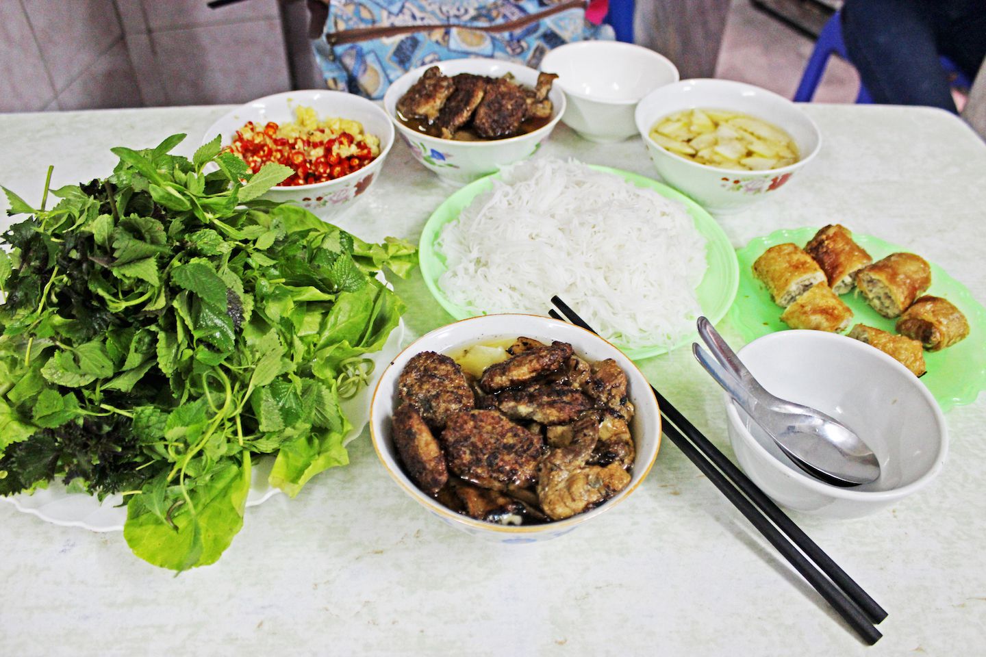 Bun cha ingredients filled the table