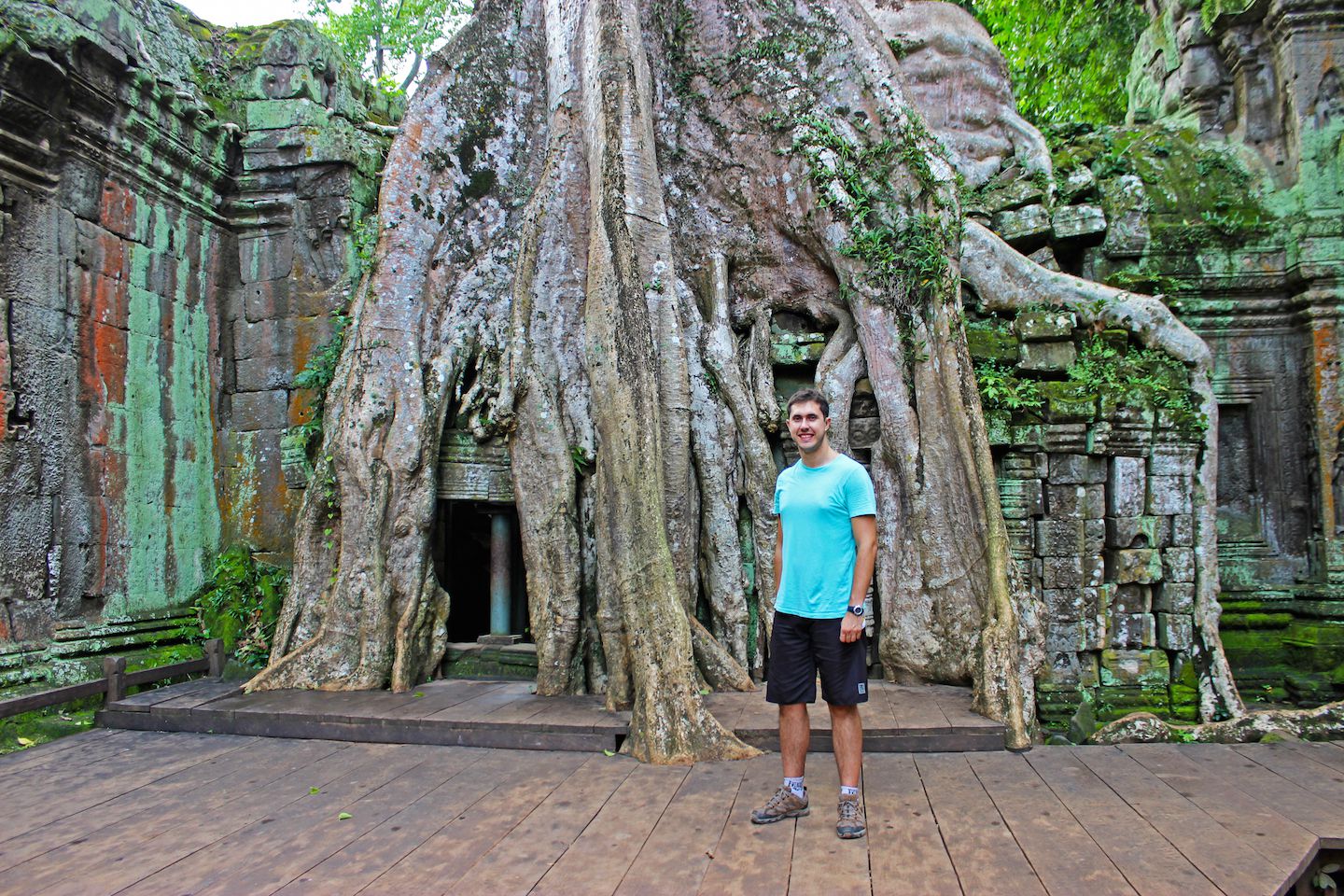 Carlos at the door taken by roots in Ta Prohm