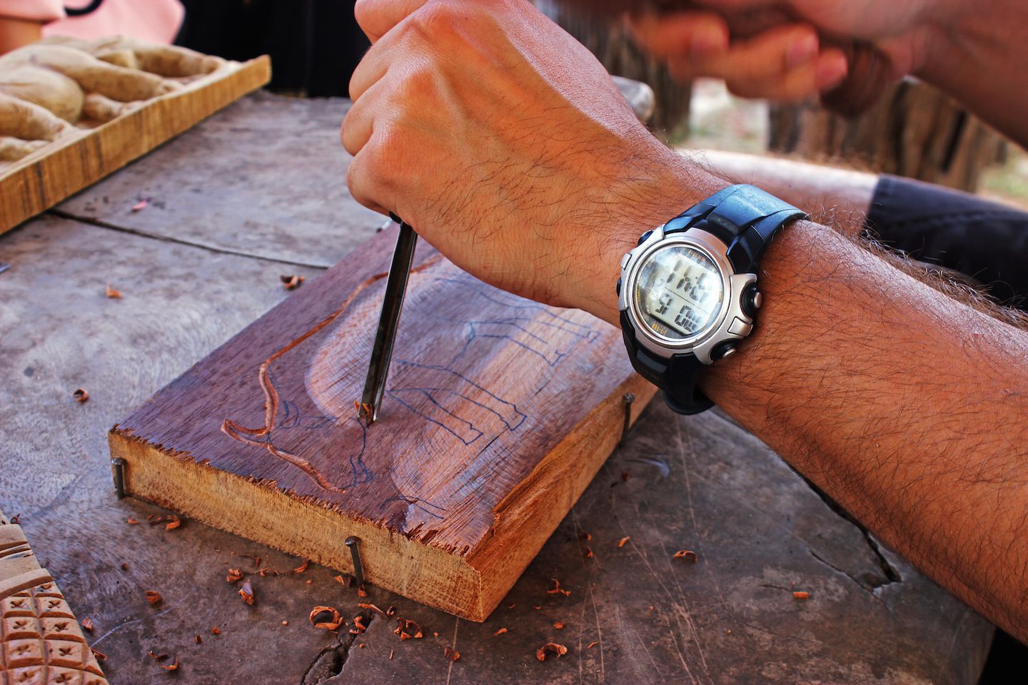 Carlos carving the initial lines on the wood, Vientiane, Laos