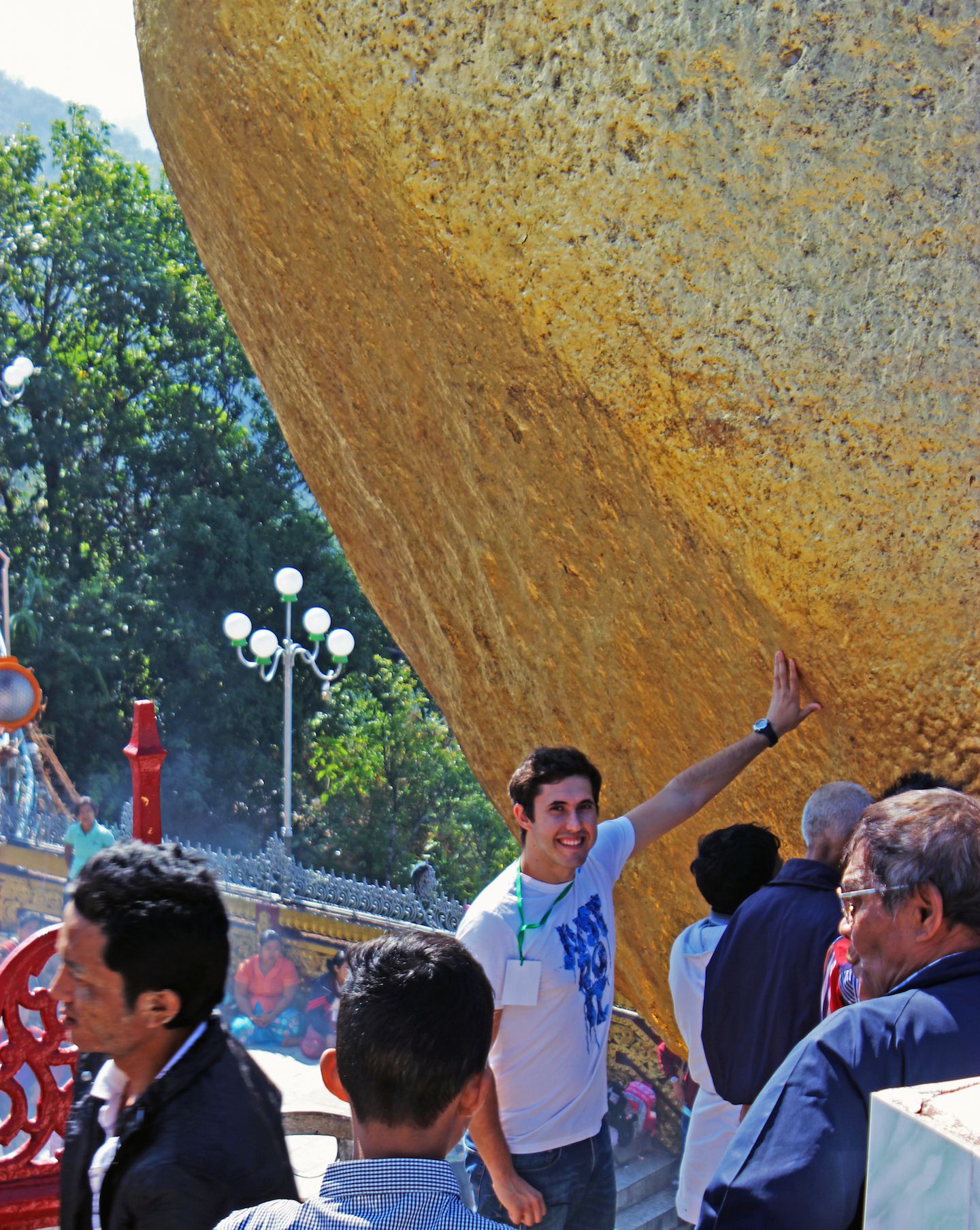 Carlos in the base zone touching the Golden Rock, Myanmar