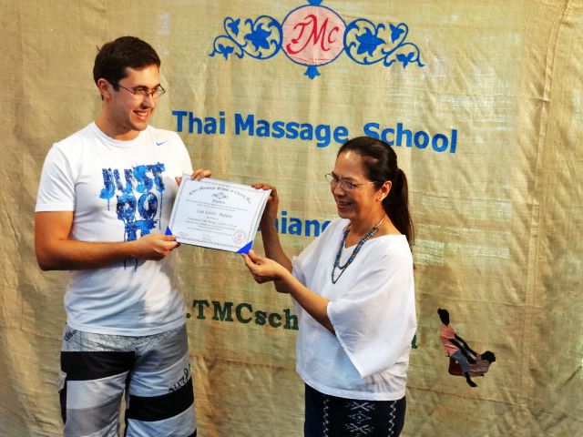 Carlos receiving his diploma at the graduation ceremony