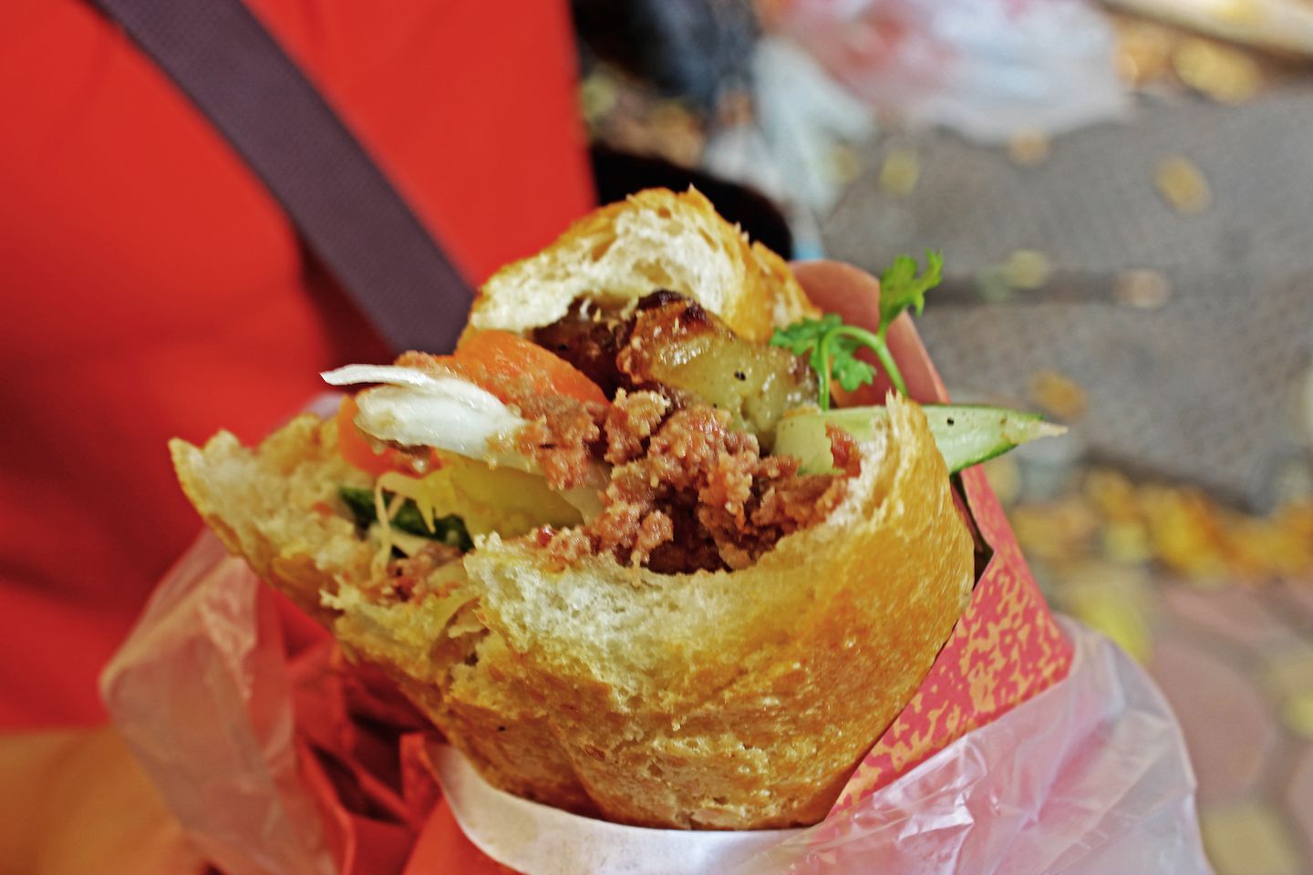 Close up of a bite of banh my