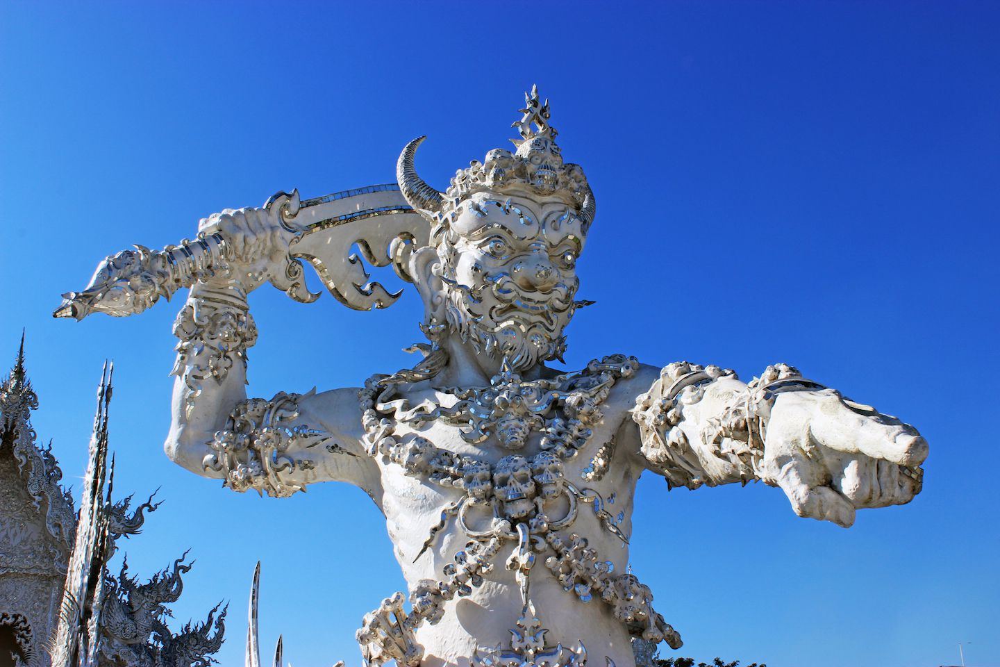 Demon guarding the bridge at the White Temple in Chiang Rai