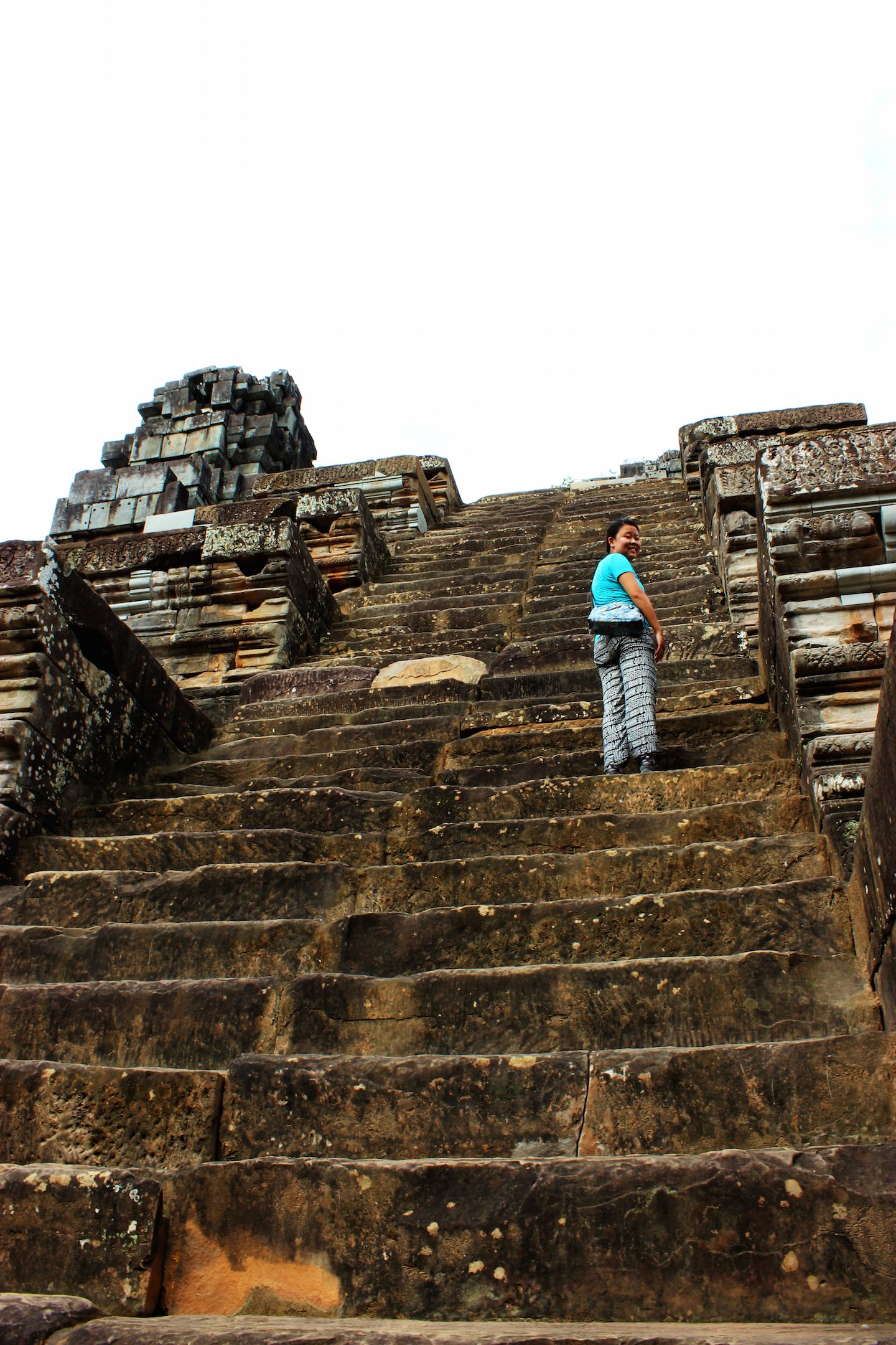 Julie climbing the stairs of Ta Keo