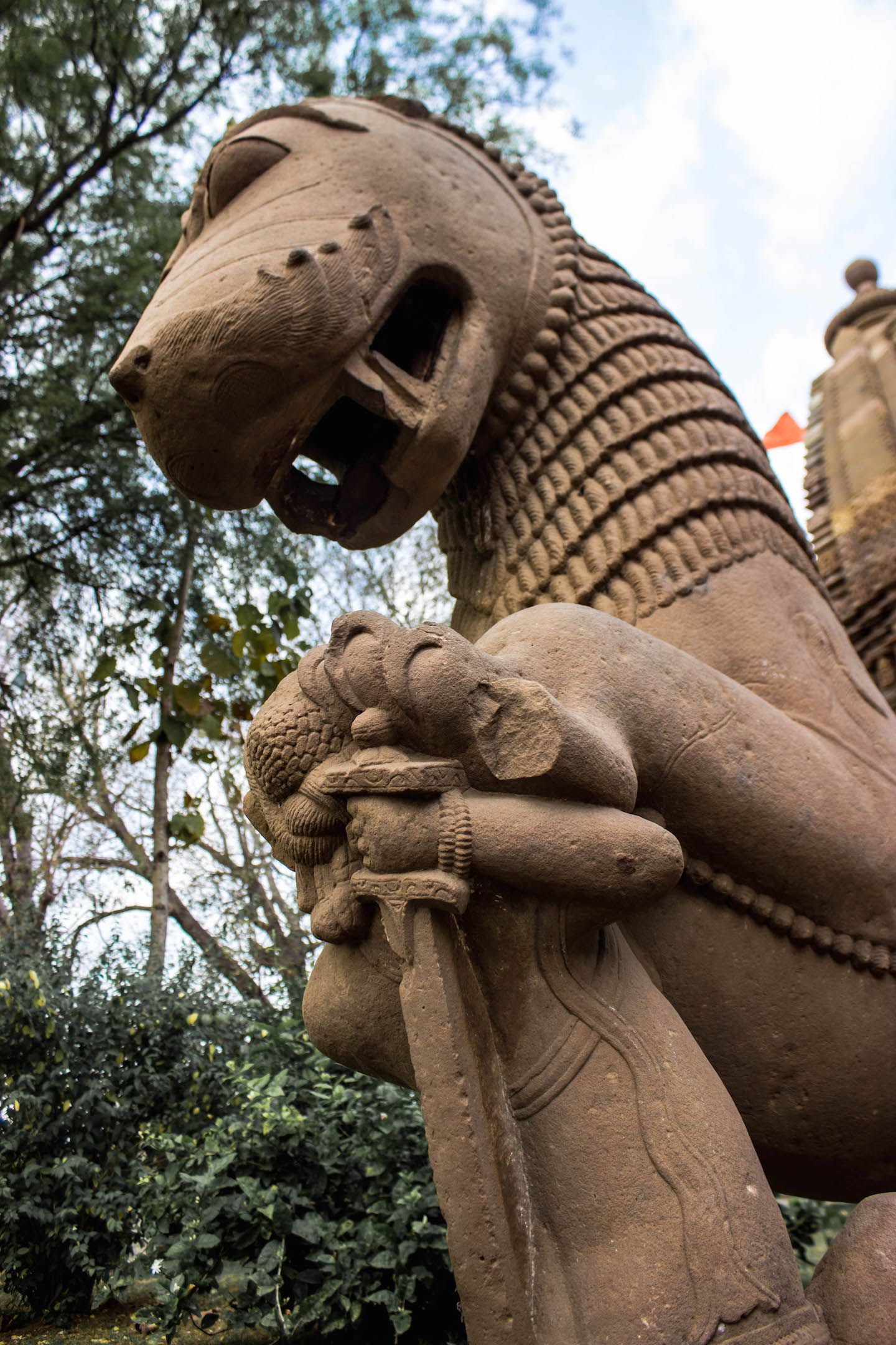 Symbol of the Chandela dynasty - a warrior fighting a lion, Khajuraho, India