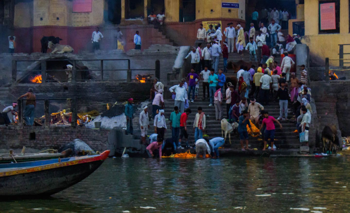 Locals bathing one of the bodies in the Ganges, Varanasi, India