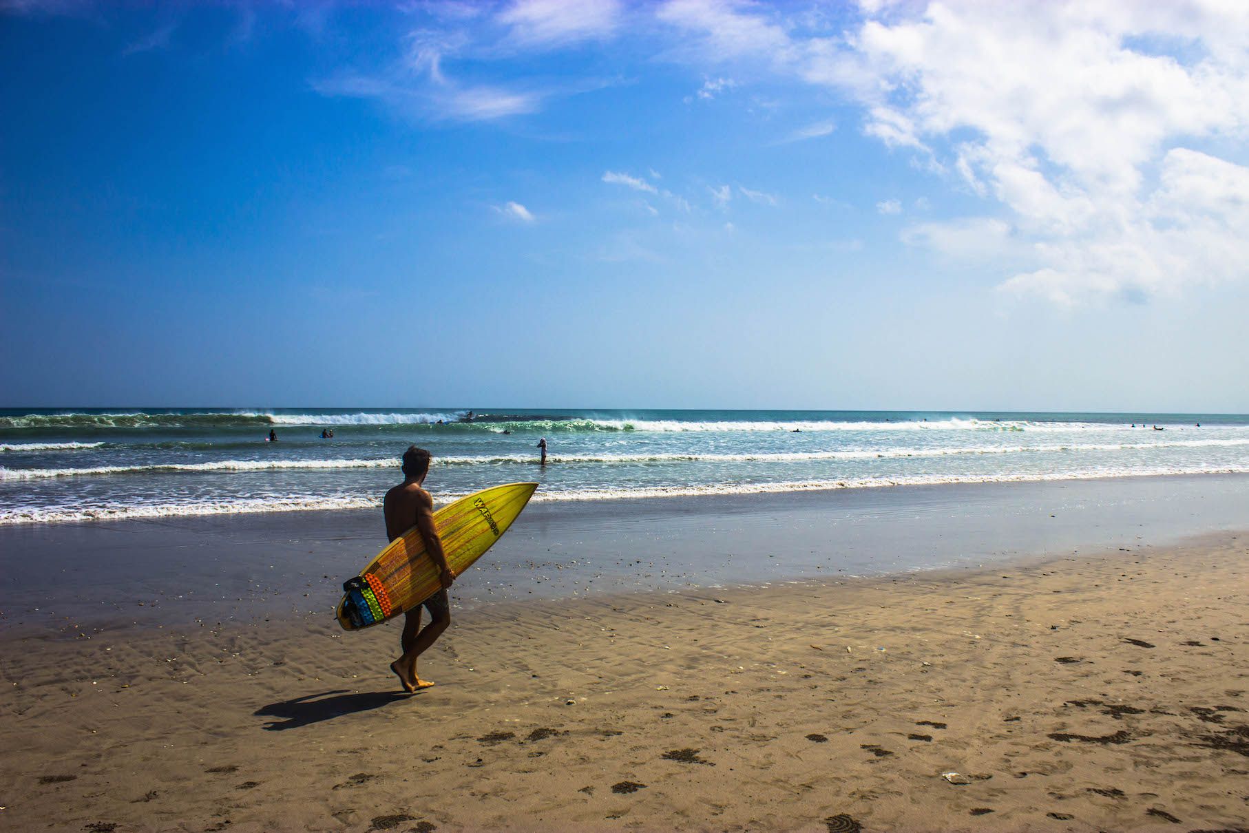 Surfer on Kuta Beach, Bali, Indonesia