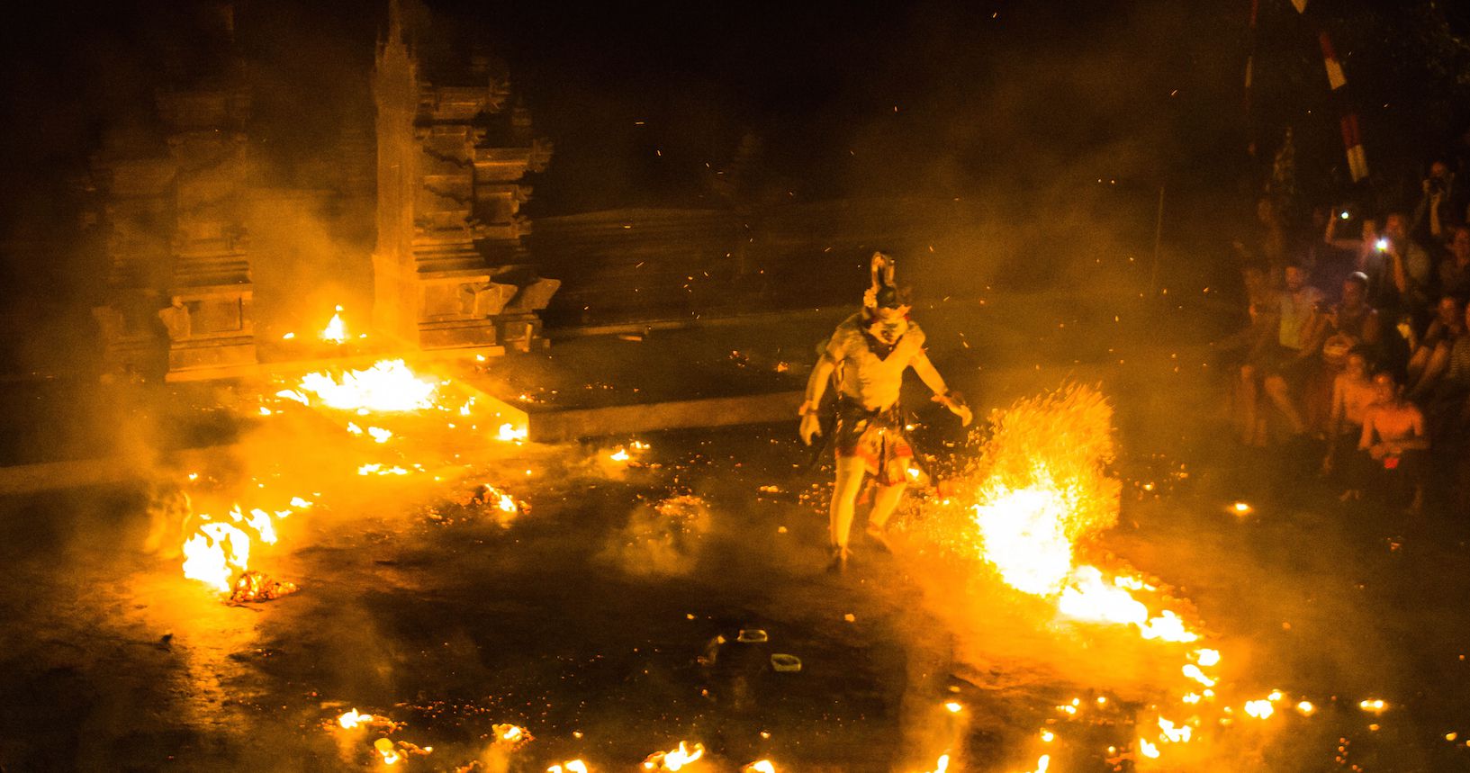Varana white monkey escaping from the fire, Uluwatu, Bali, Indonesia