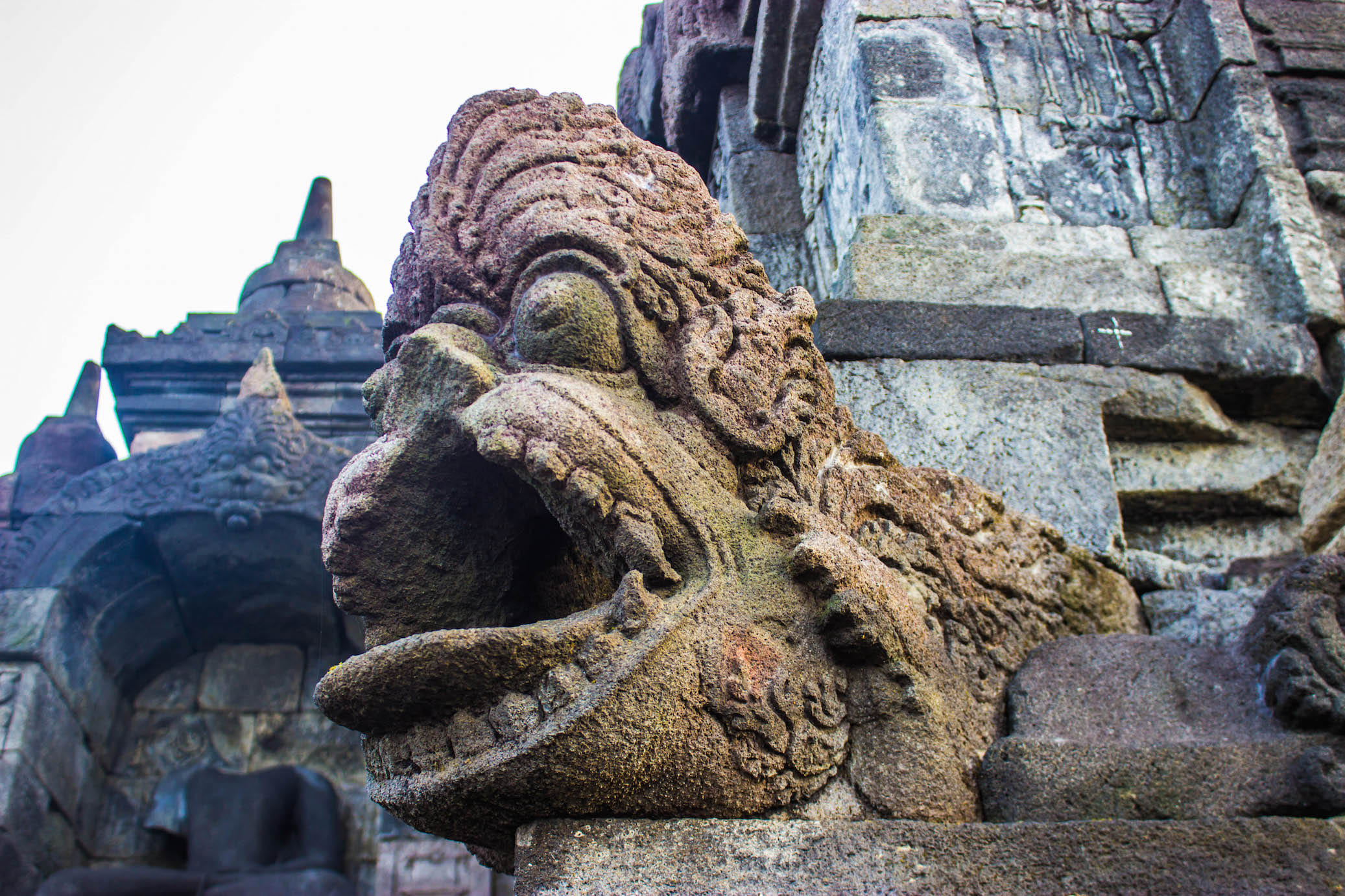 Gargoyle drain on the corners of Borobudur, Indonesia