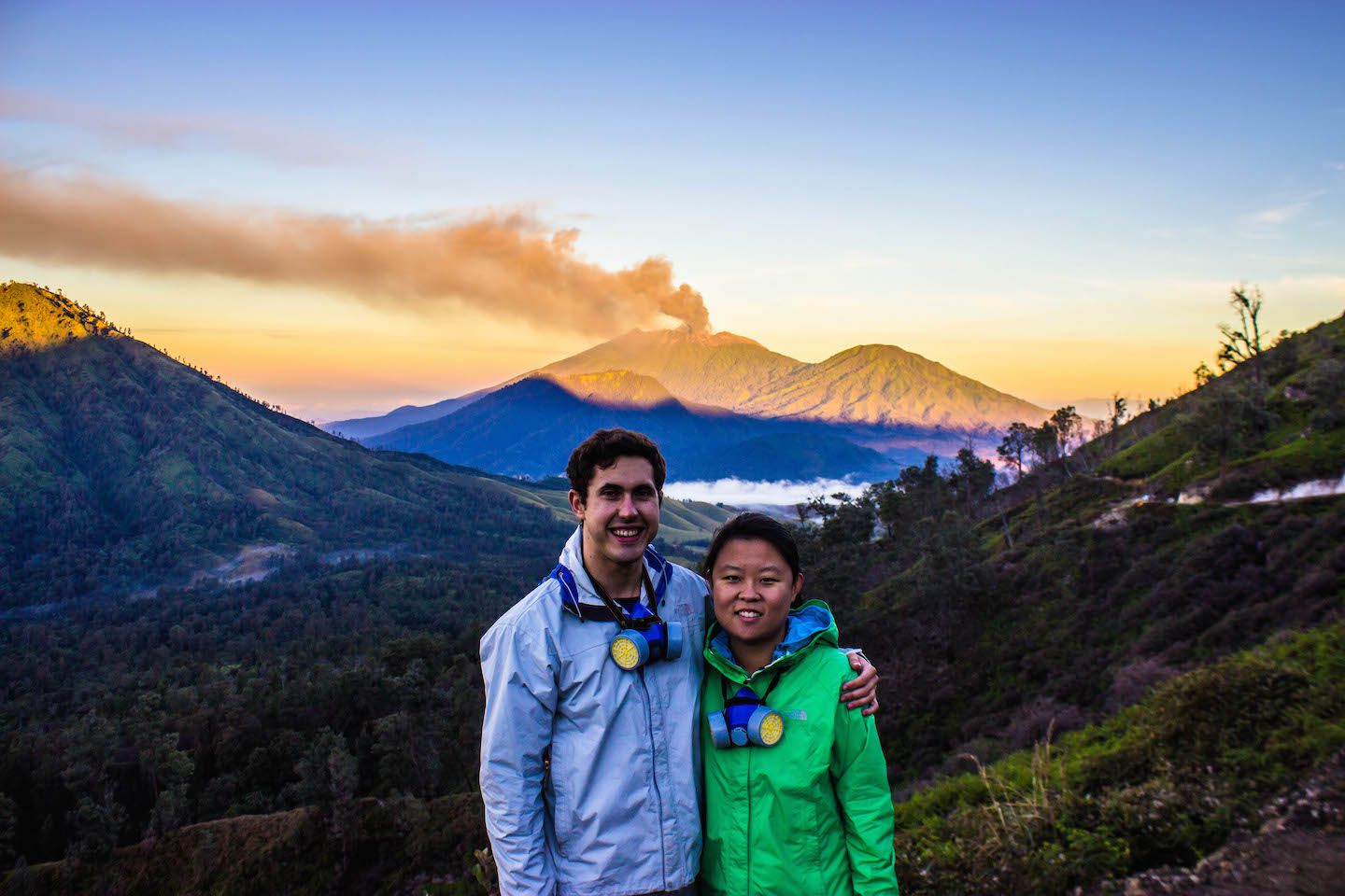 Julie and Carlos with Mt. Raung erupting in the background, Indonesia