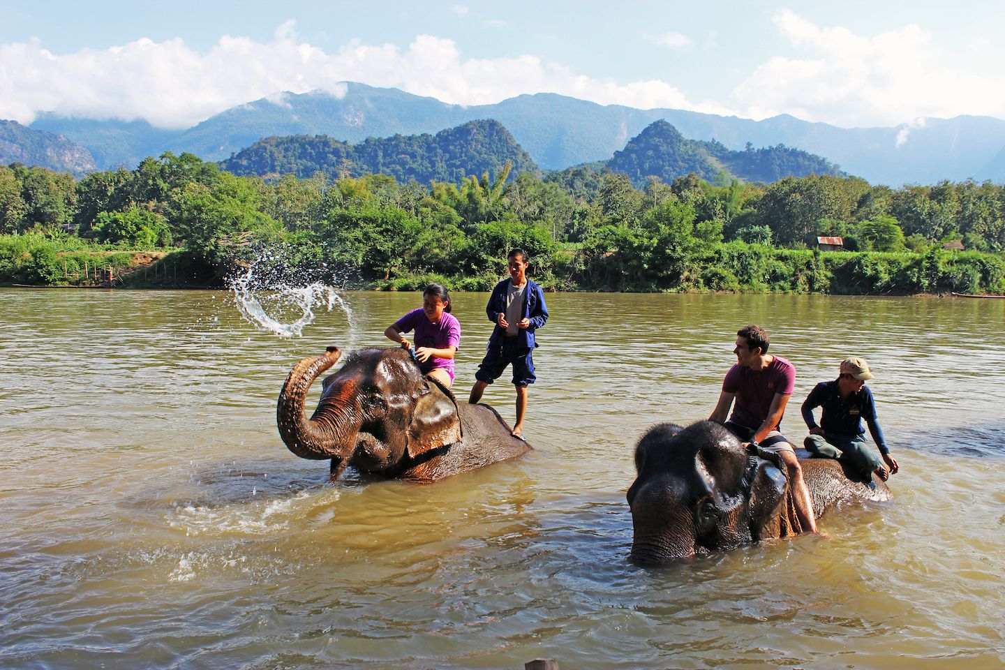 Julie and Carlos bathing the elephants, Luang Prabang, Laos
