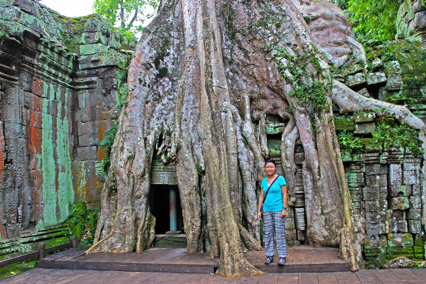 Julie at the door taken by roots in Ta Prohm