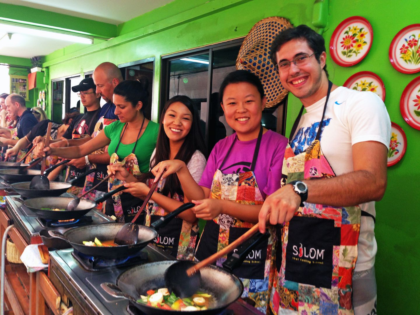 Julie, Carlos and Abby cooking a Tom Yum soup, Bangkok, Thailand