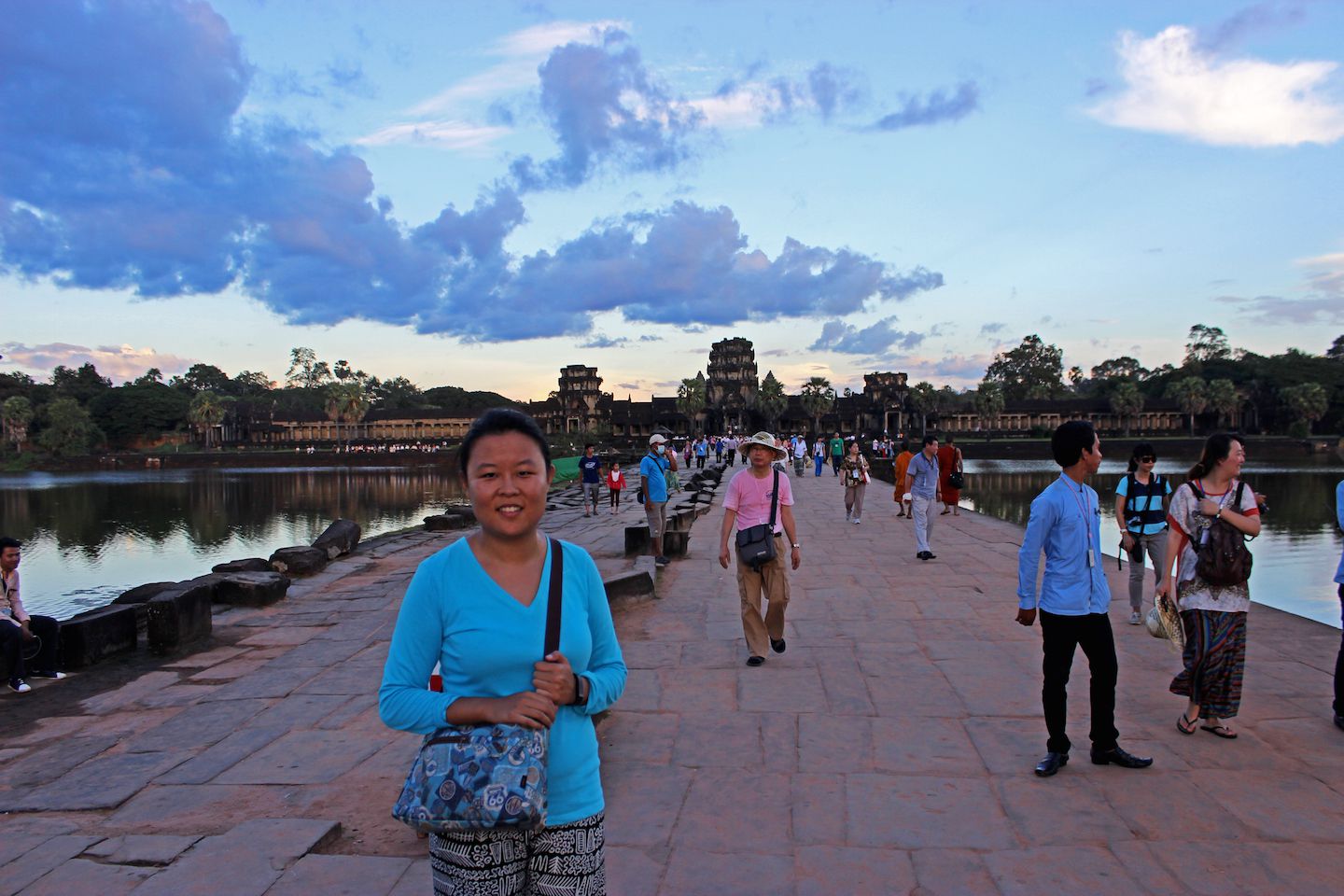 Julie crossing the moat at Angkor Wat