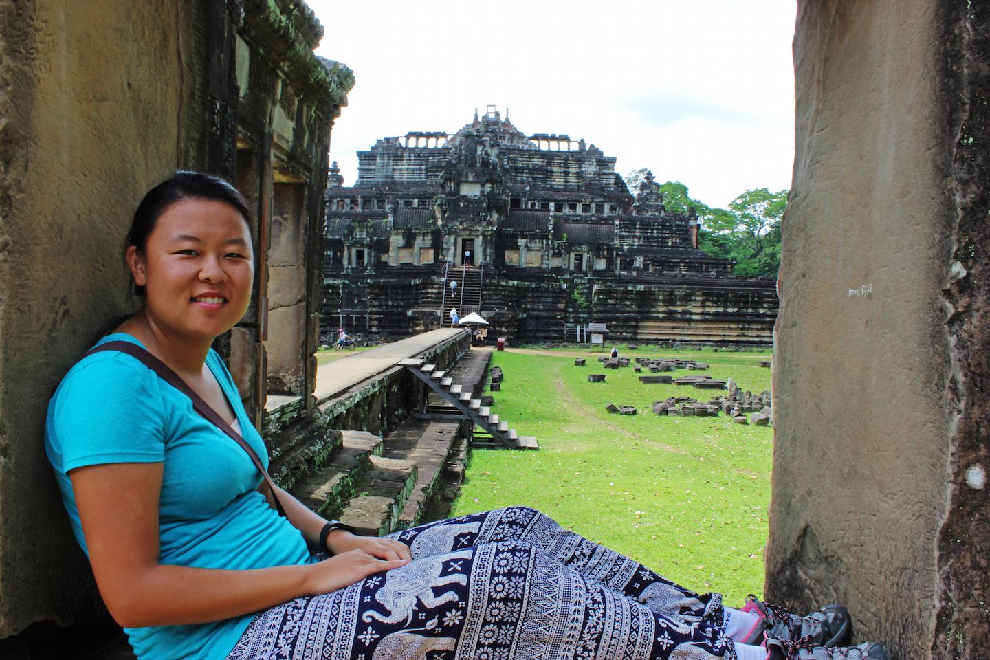 Julie sitting on the windows of Baphuon