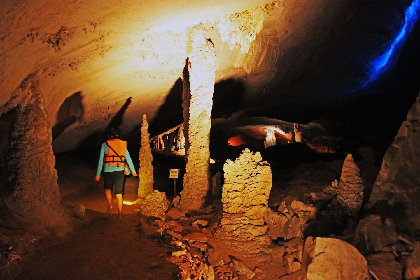 Julie walking among stalagmites and stalactites, Konglor Cave, Laos