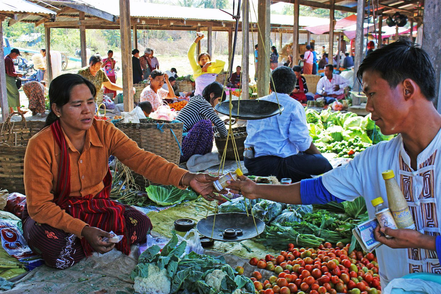 Locals trading at the sunday market in Inle Lake, Myanmar