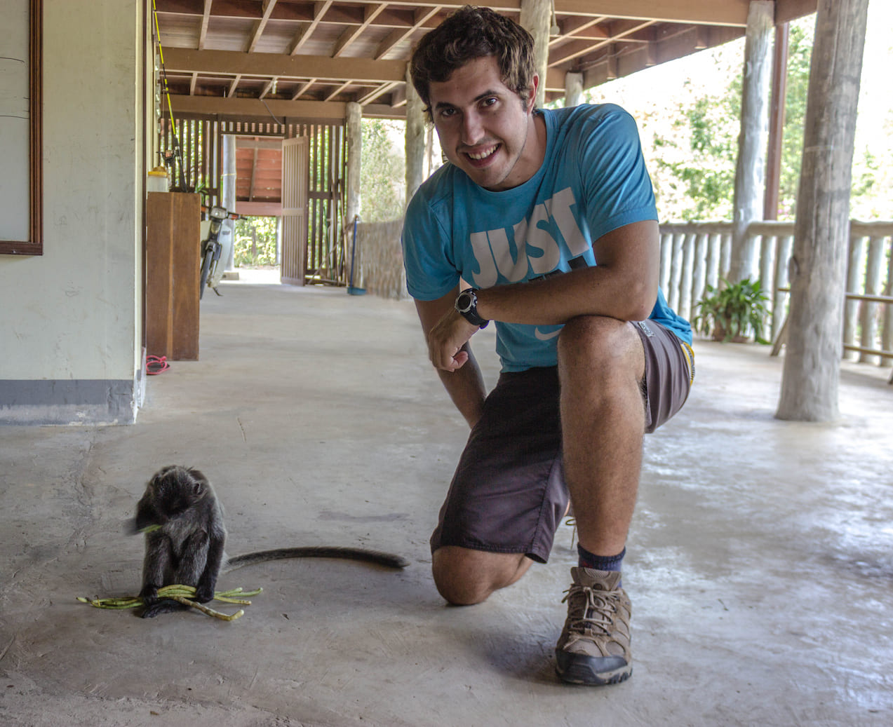 Carlos and a silvered leaf monkey at the Labuk Bay Proboscis Monkey Sanctuary, Malaysia