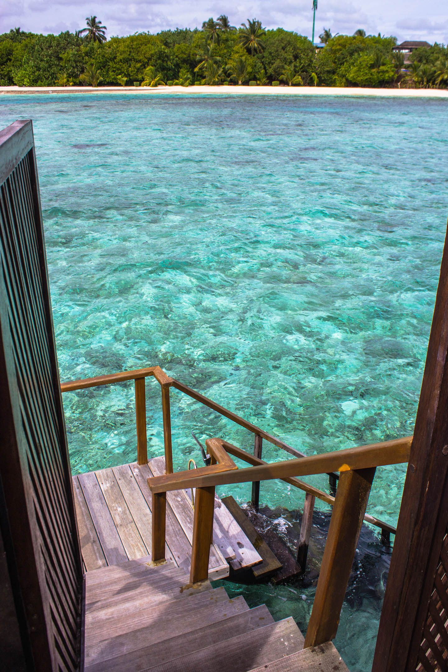 Private stairs in the water bungalows leading to the water, Vadoo Resort, Maldives