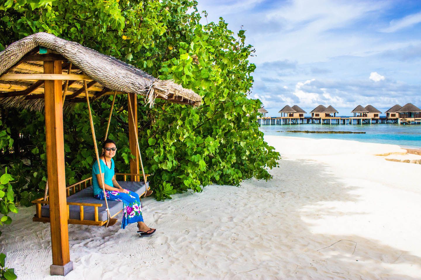 Julie sitting on the swing at Vadoo Resort, Maldives
