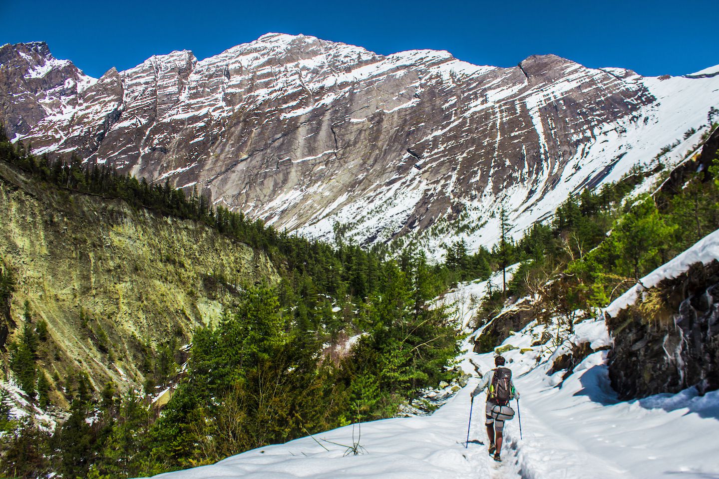 Carlos trekking on the snow with the Heaven's Door in the background, Nepal