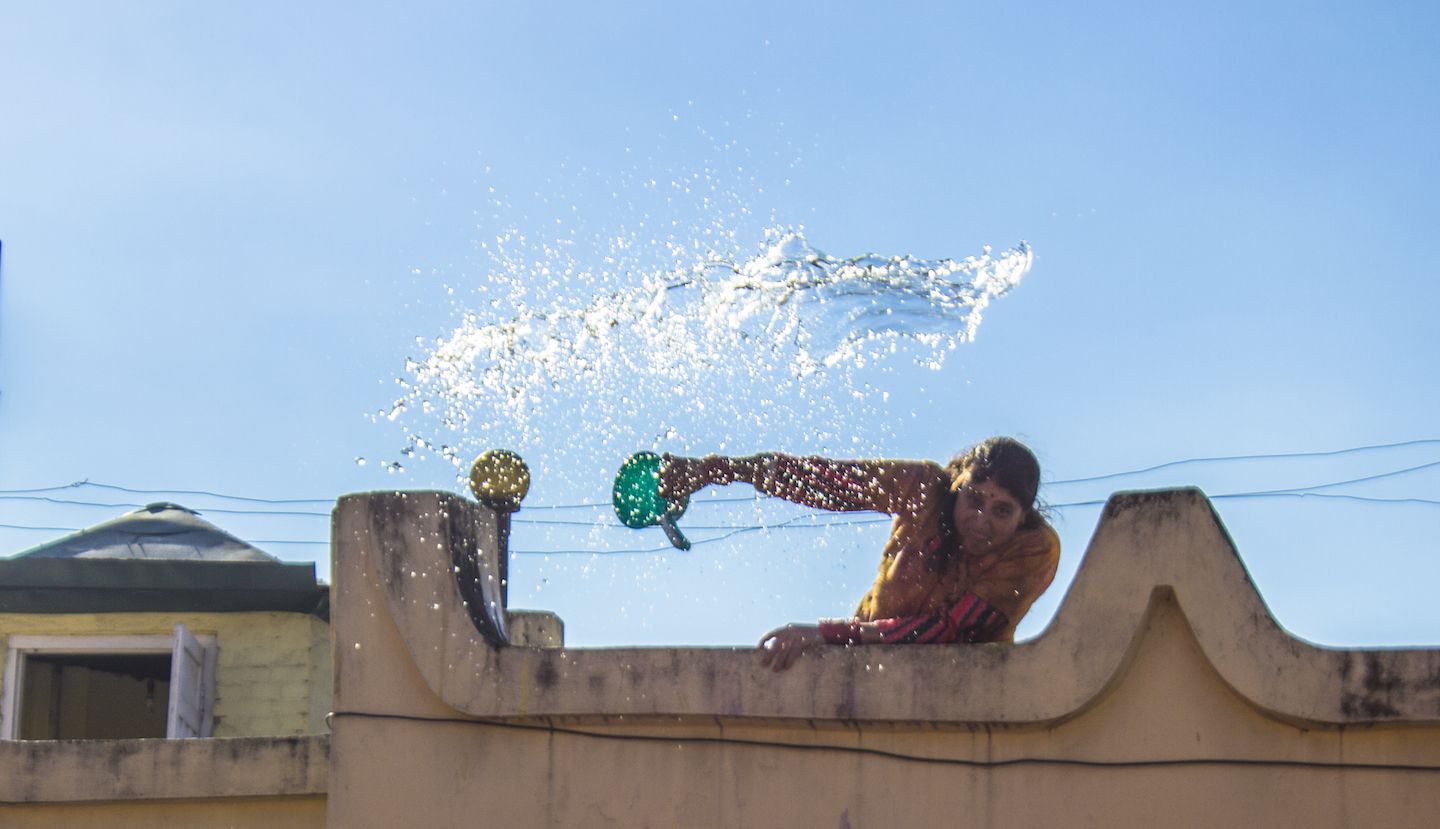 Local throwing water at us during Holi, Kathmandu, Nepal
