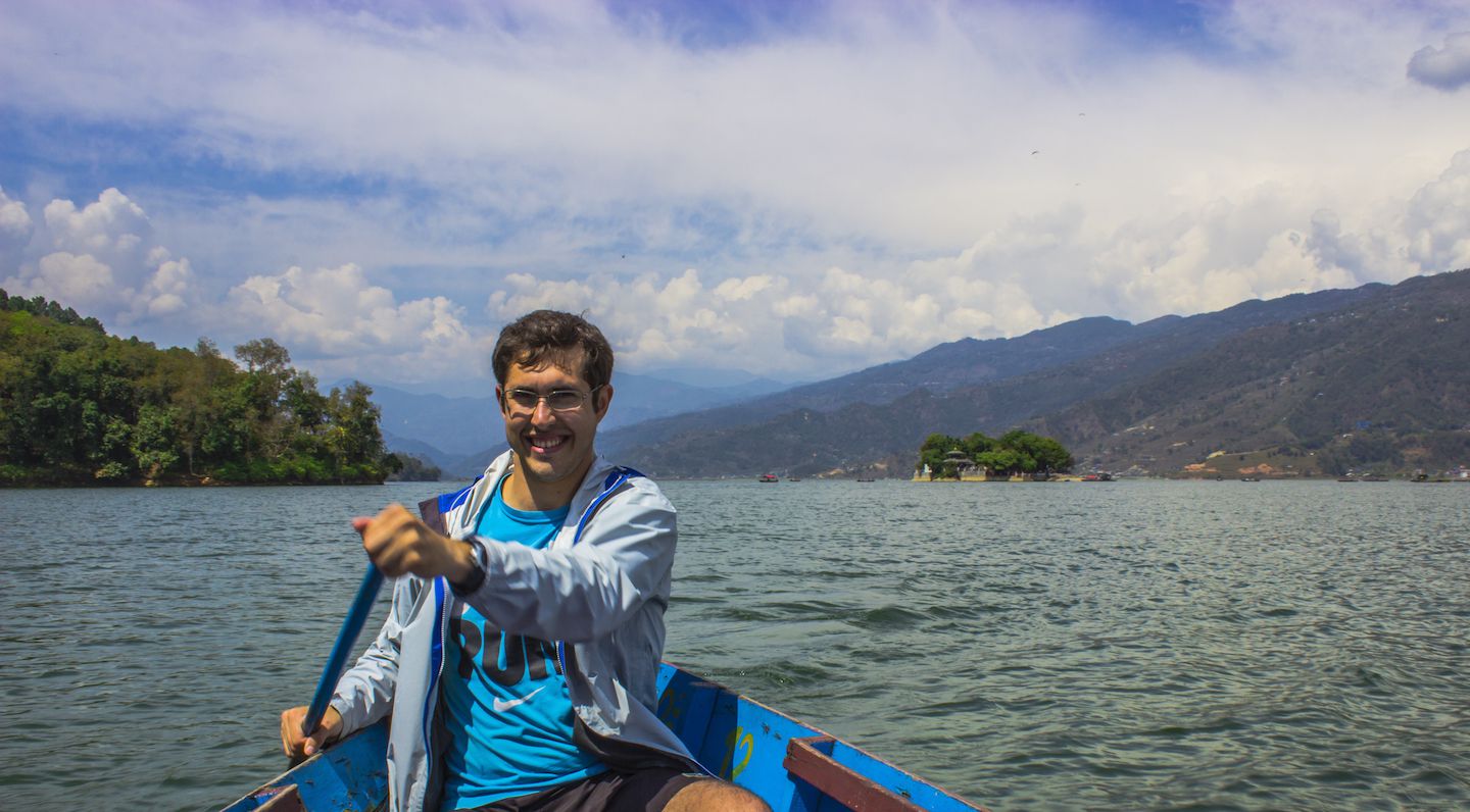Carlos rowing the wooden boat in the Phewa Lake, Pokhara, Nepal