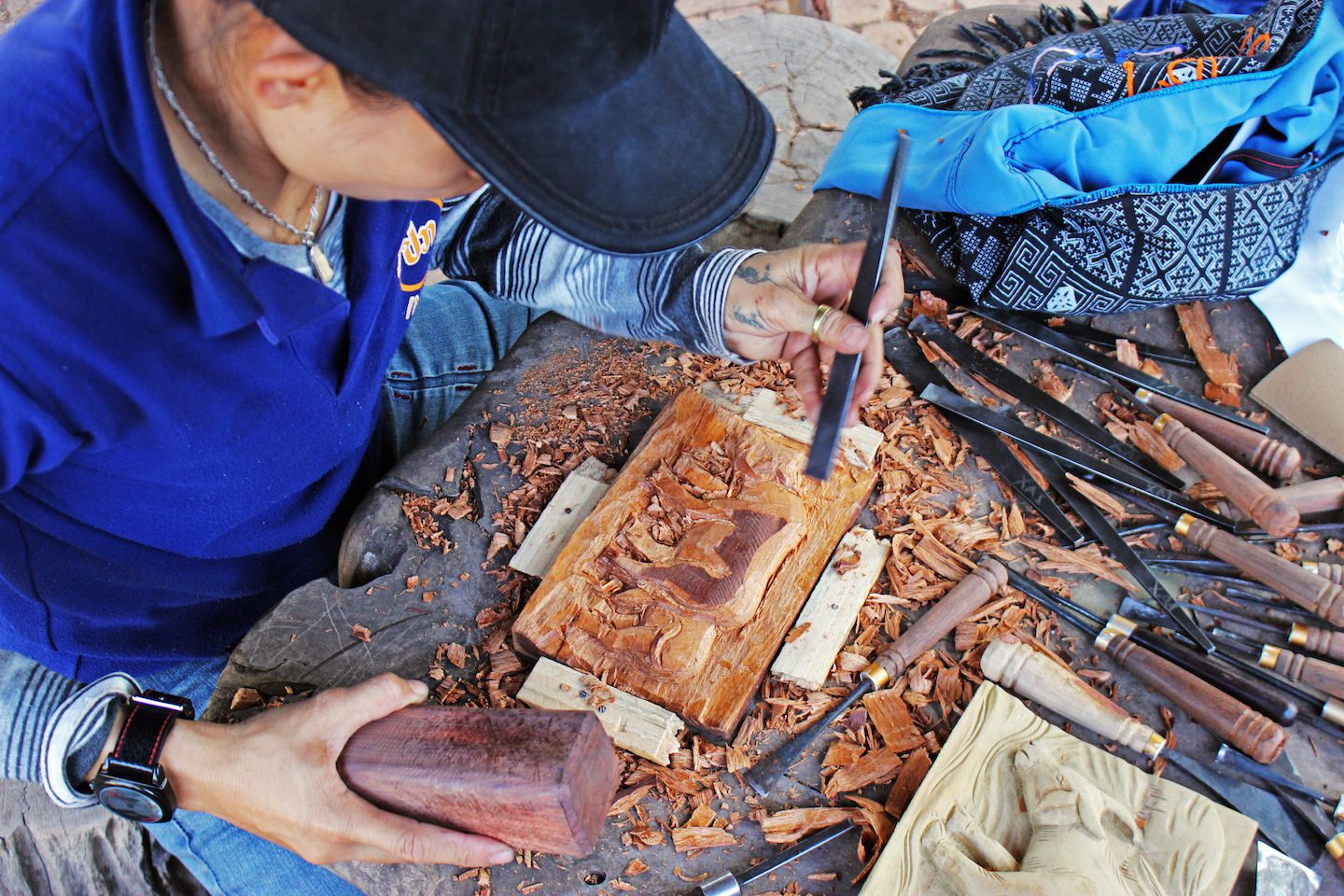 Our Backstreet Academy teacher fixing the wood carvings, Vientiane, Laos