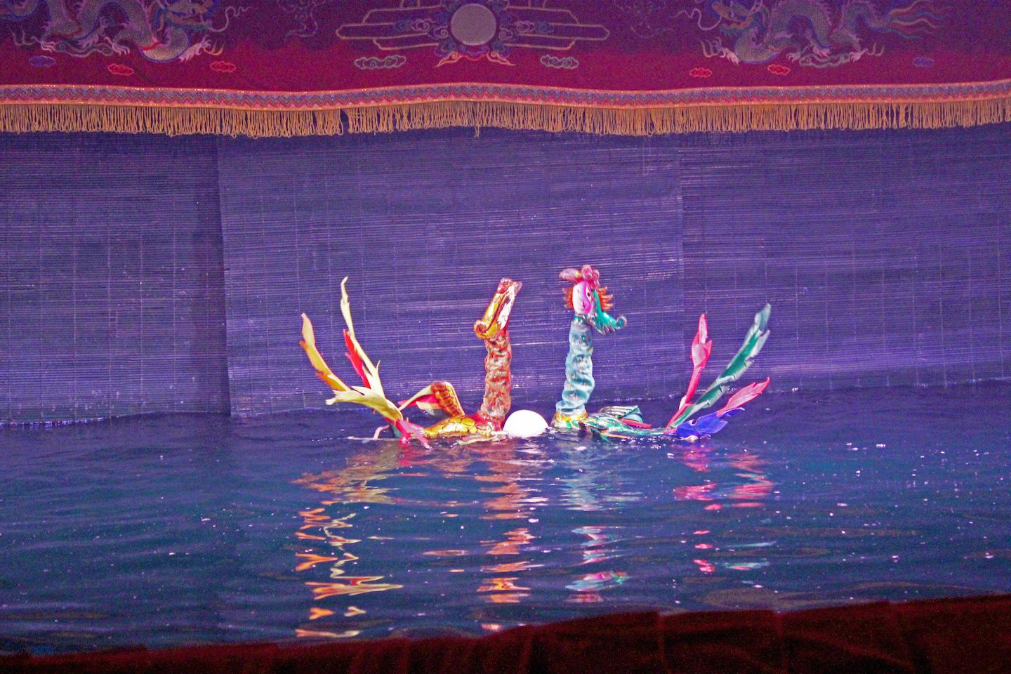 Phoenix puppets putting an egg