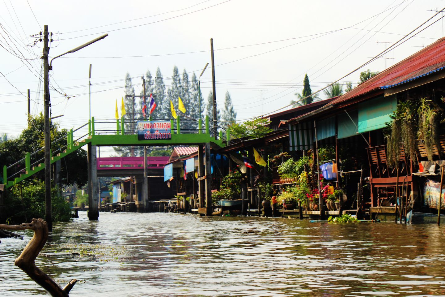 Riding into the floating market, Bangkok, Thailand